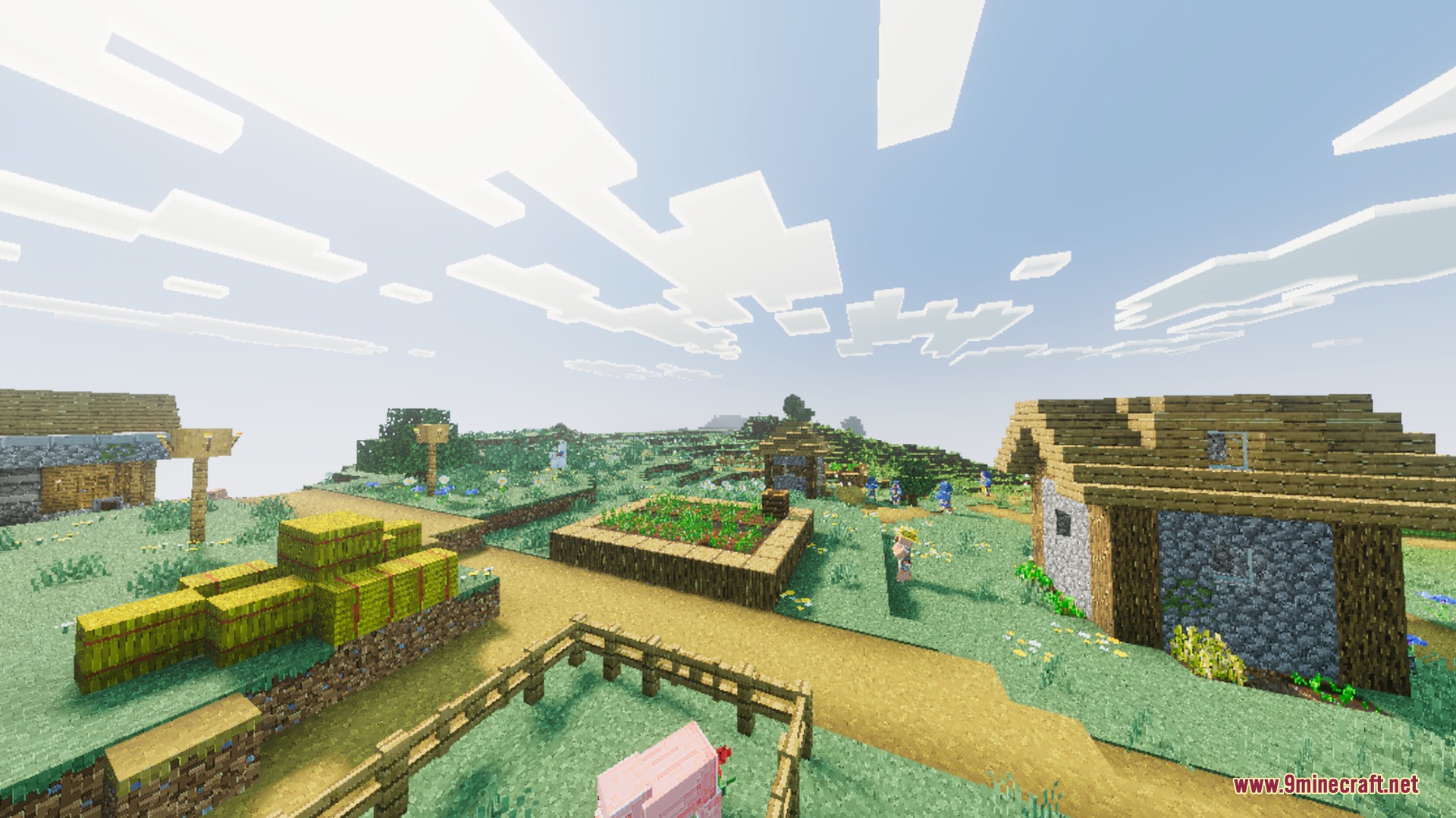 Diablo Visuals for Vibrant Visuals Shader Screenshot 3 A sunny Minecraft village featuring hay bales and a small animal pen
