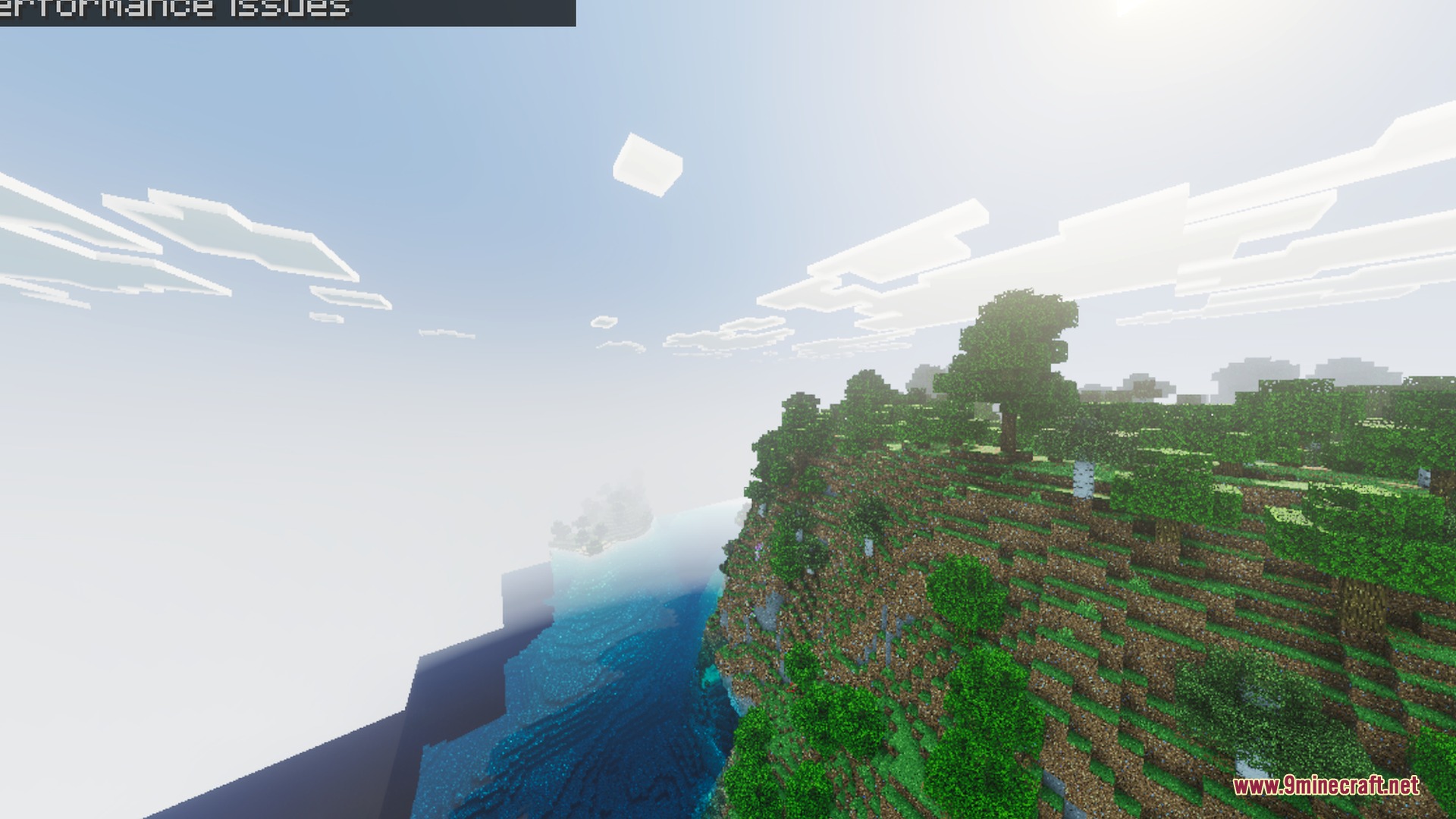 Diablo Visuals for Vibrant Visuals Shader Screenshot 4 Lush green trees grow on a steep cliff overlooking clear blue water
