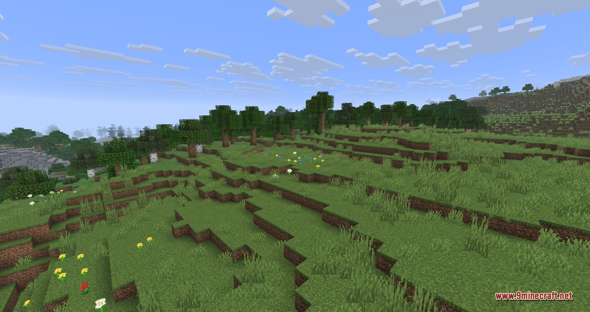 Disable Custom Worlds Advice 9minecraft Mod Screenshot 4 A peaceful green field in Minecraft with colorful flowers and a forest background