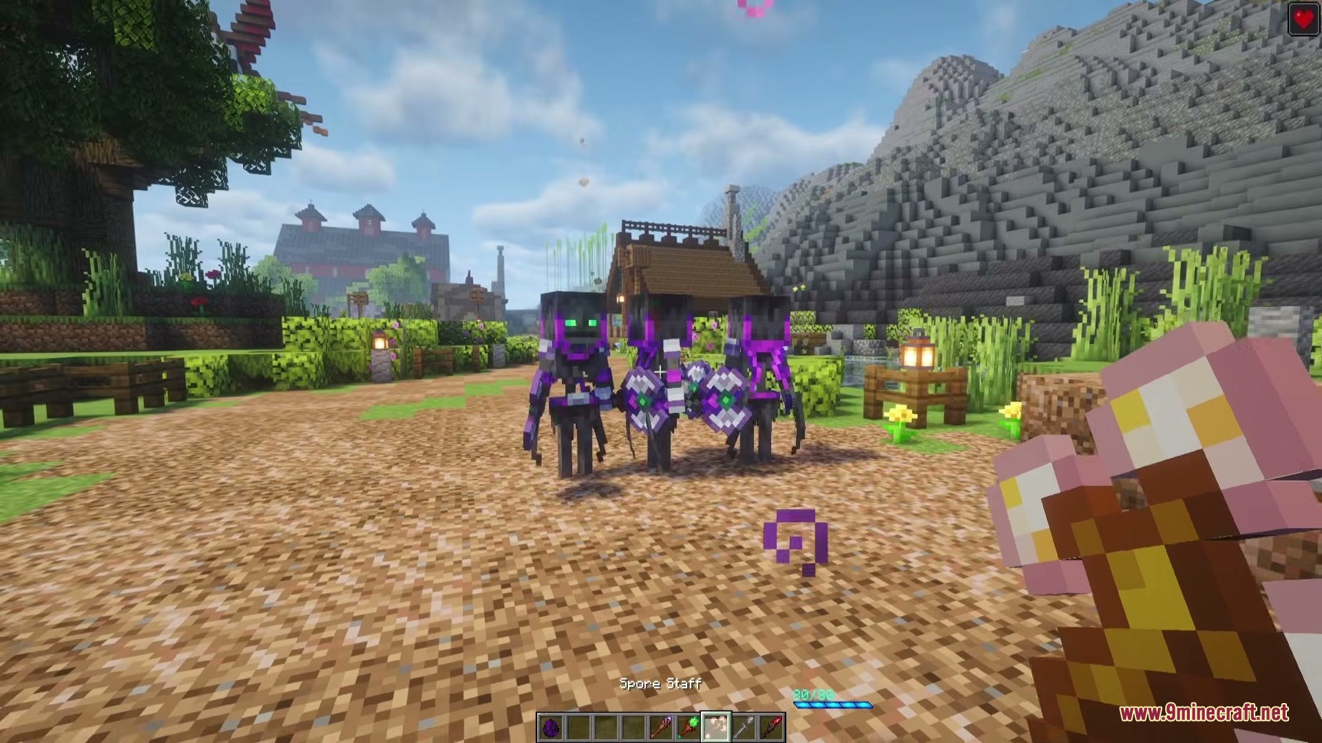 Doom Tide Rising Mod Screenshot 2 Player holding a magical staff faces glowing purple skeletons in a village