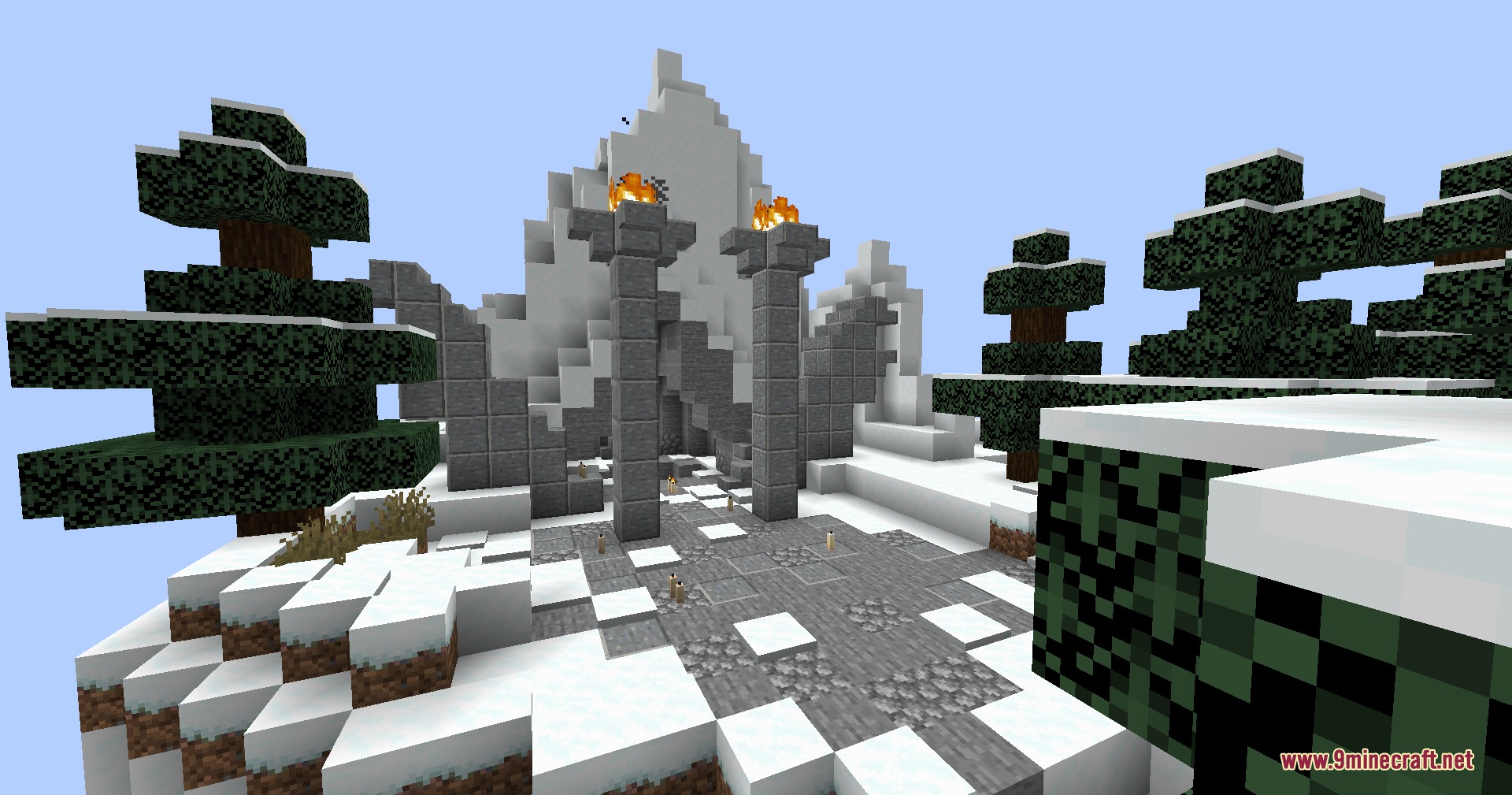 Dragon Priest Mod Screenshot 5 Stone pillars and torches guard the entrance of a snowy mountain ruin