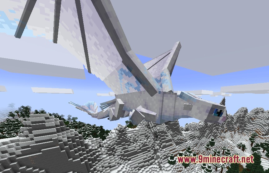A white Light Fury dragon flies through the sky above snowy mountains