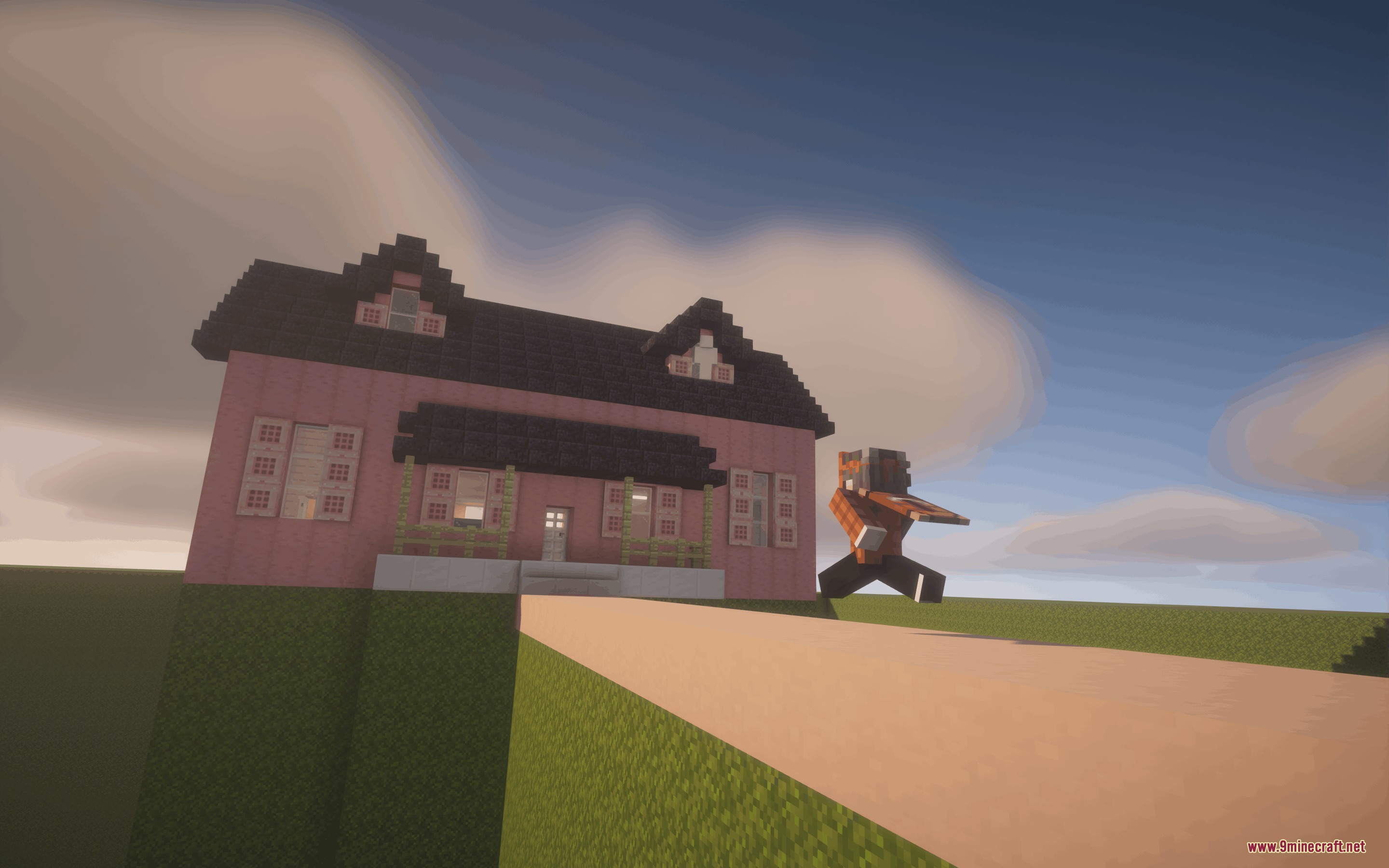 Dreamshift Mod Screenshot 3 A player character jumps near a pink house under a cloudy sky