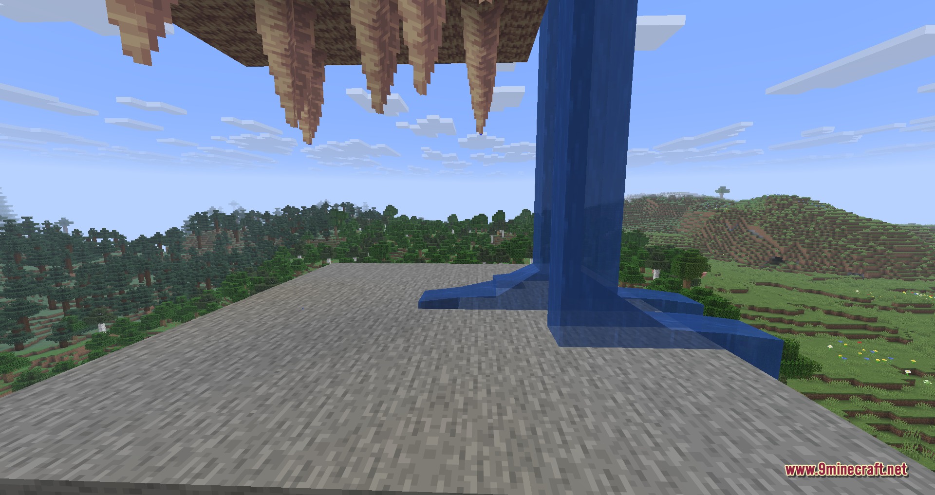 Close up of water falling from a stalactite onto a stone block surface