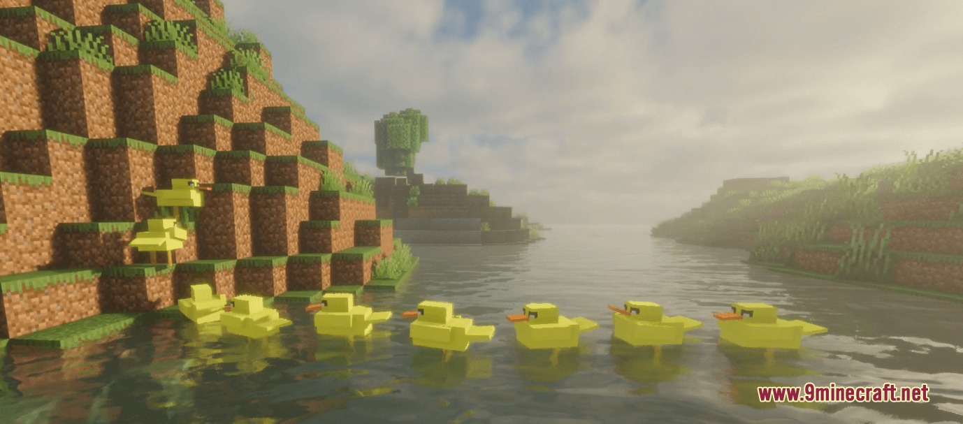 A flock of yellow ducks swimming in a line through a river