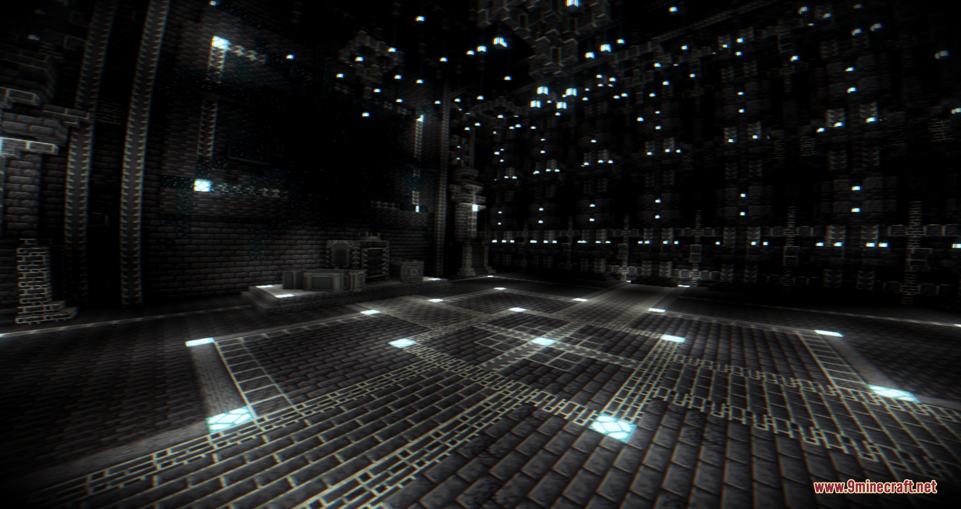 A massive dark stone chamber inside the Ancient Keep with glowing blue lights