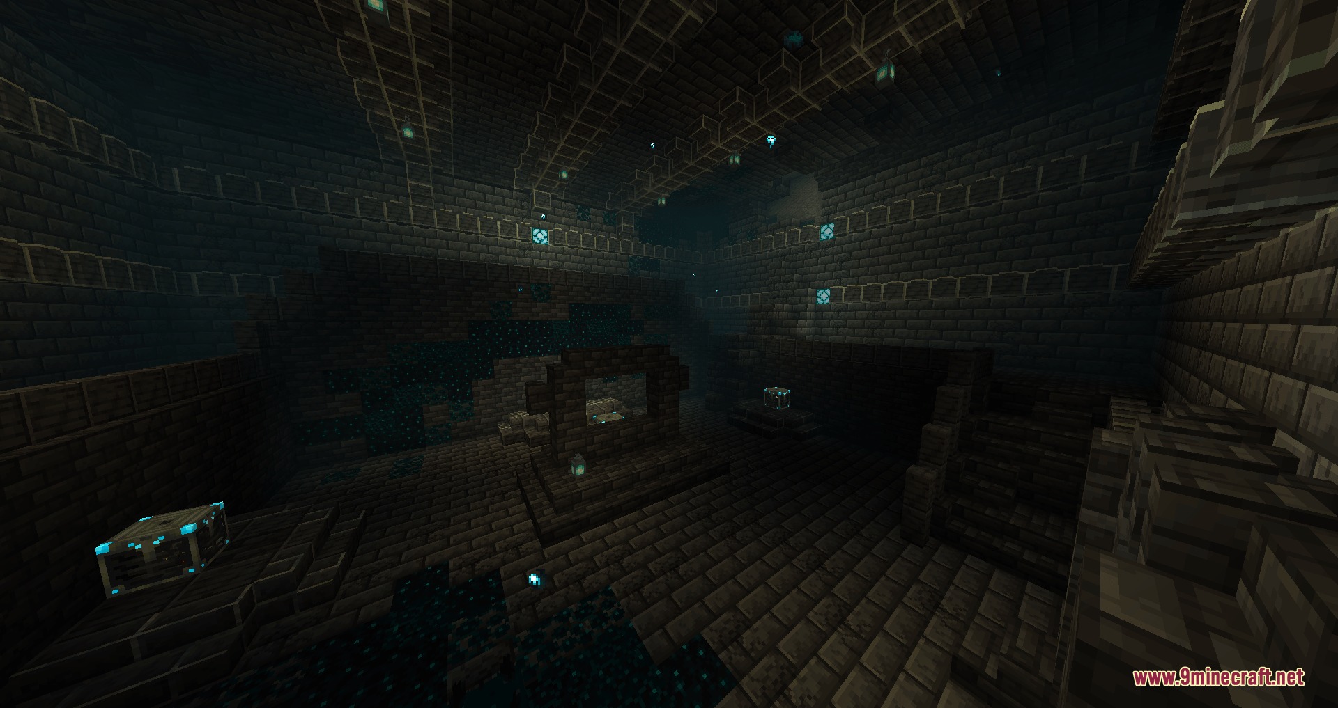 A dark underground chamber with sculk patches and glowing blue soul lanterns