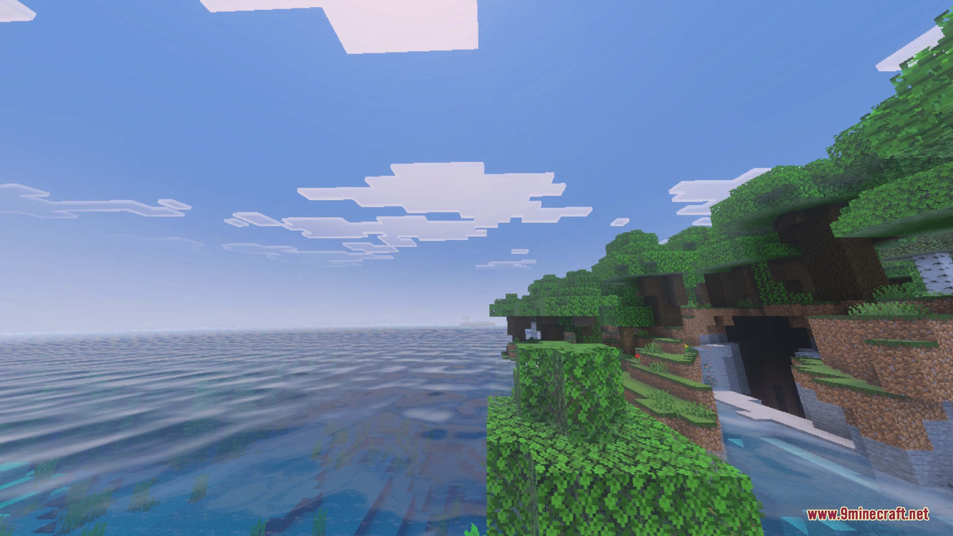 Dynamic Wave Shader Screenshot 2 Lush green shoreline overlooking a vast sea with realistic dynamic water wave effects