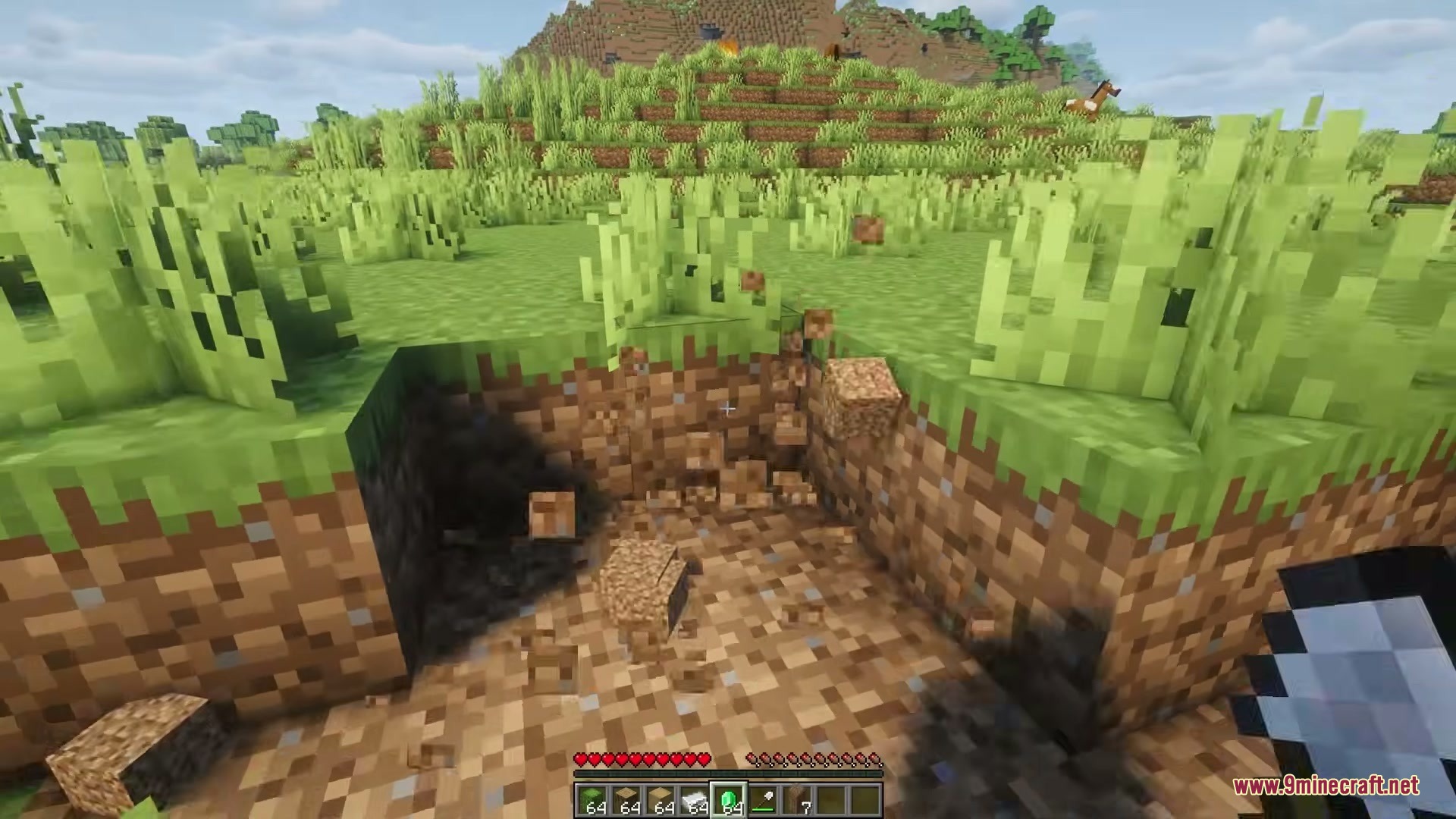 Eating Animations Mod Screenshot 1 Player digging a hole in the ground with dirt blocks breaking apart
