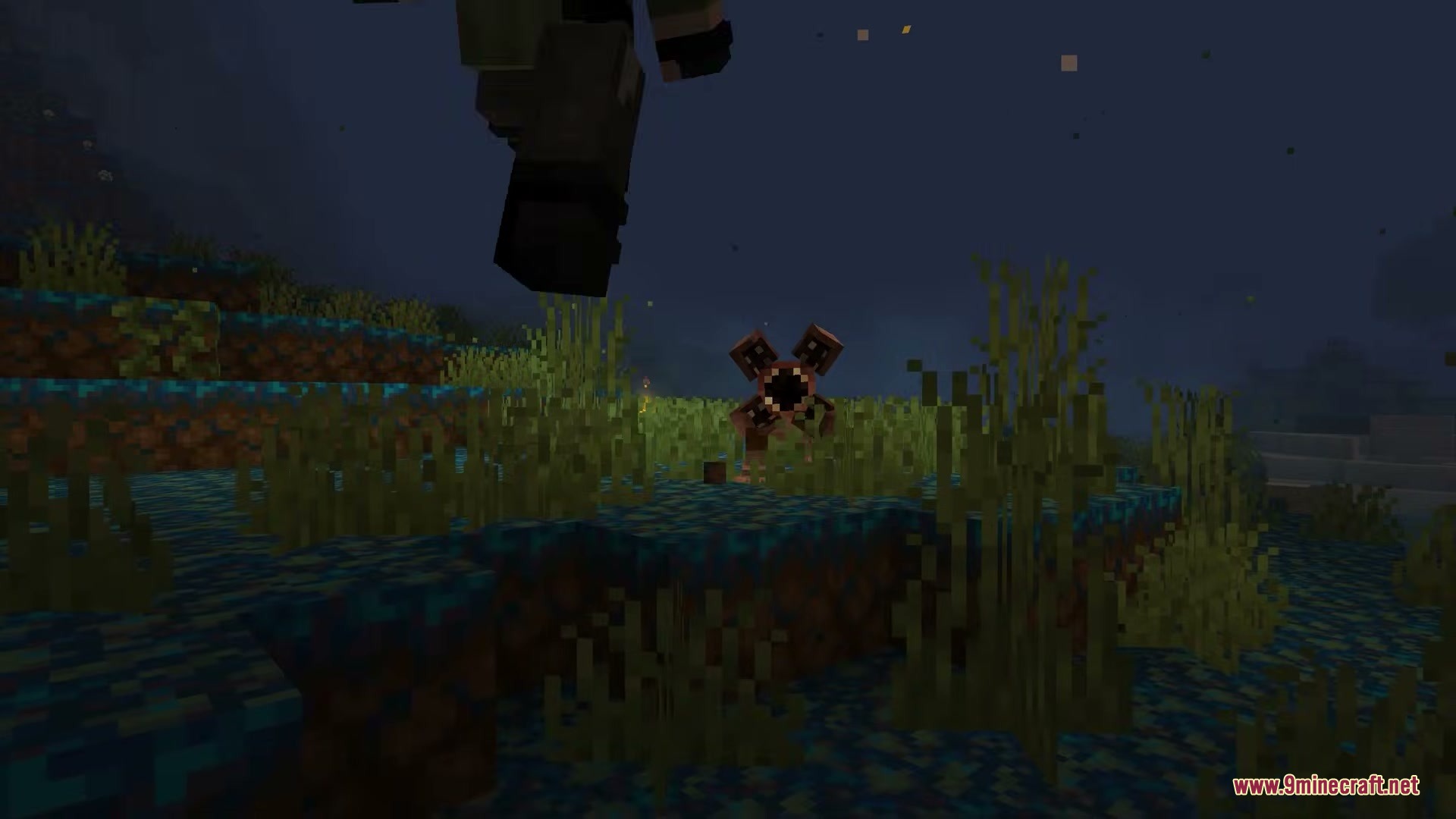 Echoes of the Void Mod Screenshot 3 A player jumps over a Demogorgon standing in the tall grass at night