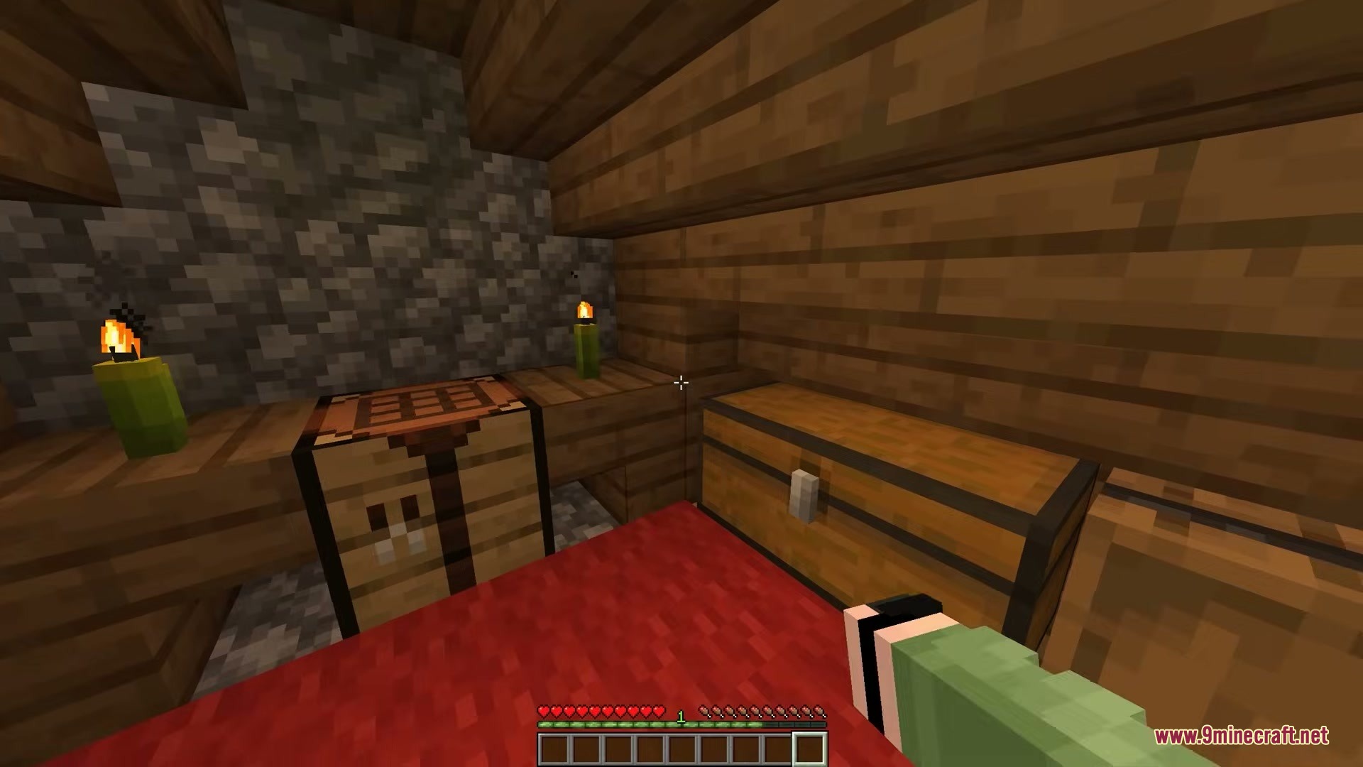 A player stands in a wooden room with a crafting table and chest