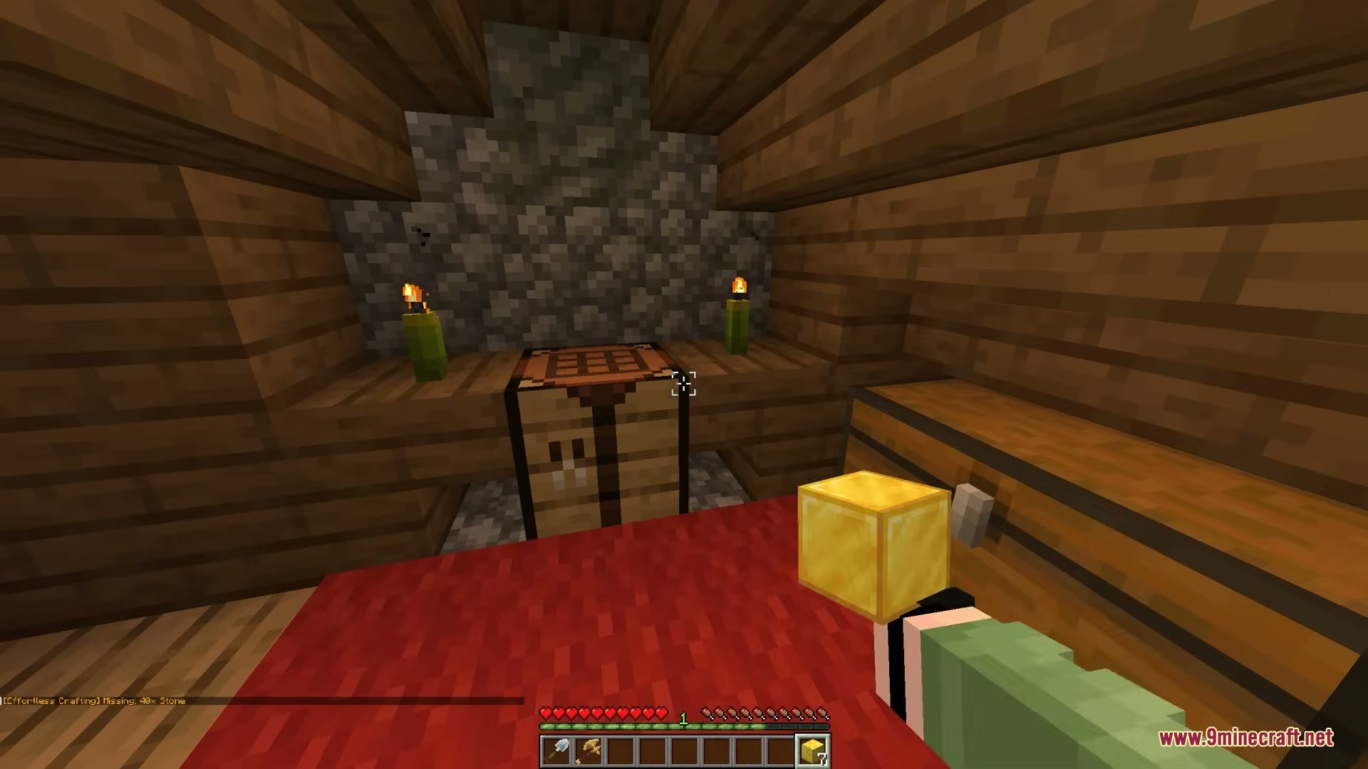 Player holding a gold block while standing in front of a crafting table