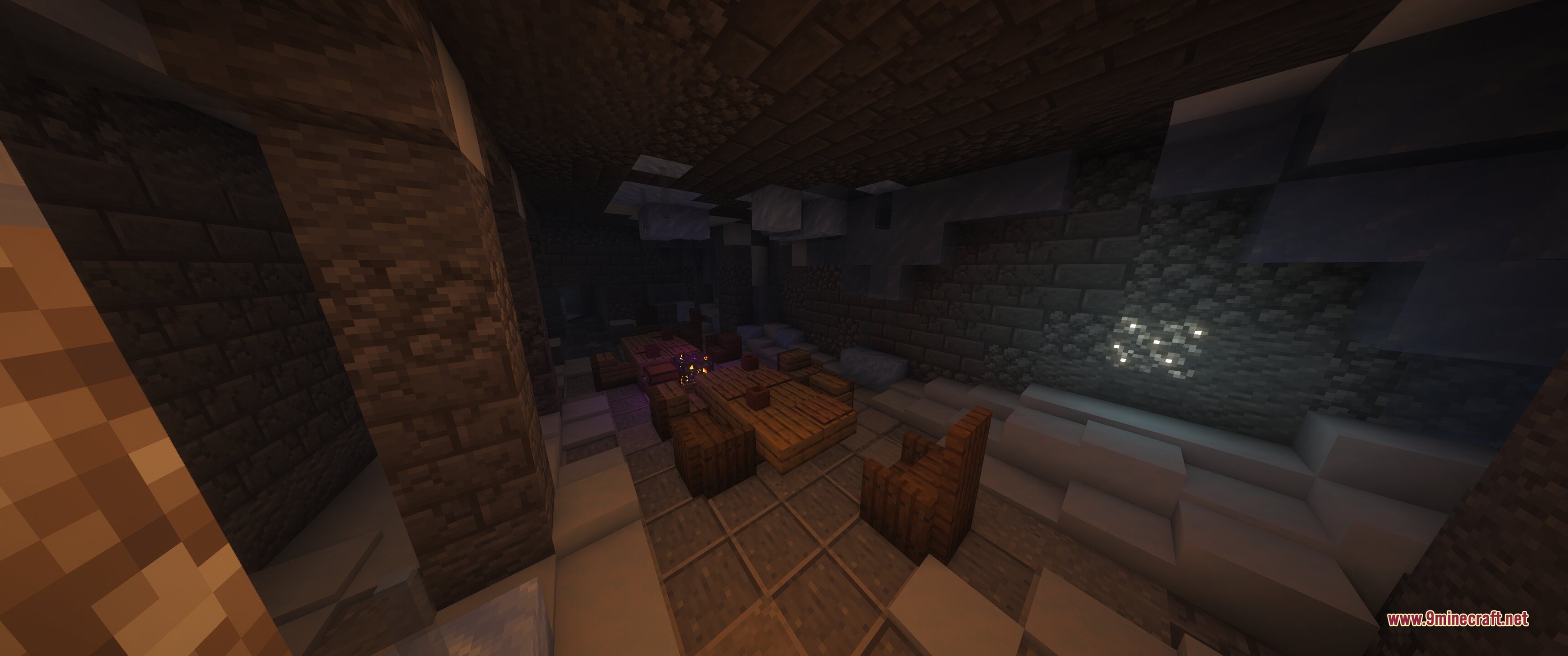 Spacious dungeon room with wooden furniture and stone walls in a snowy biome