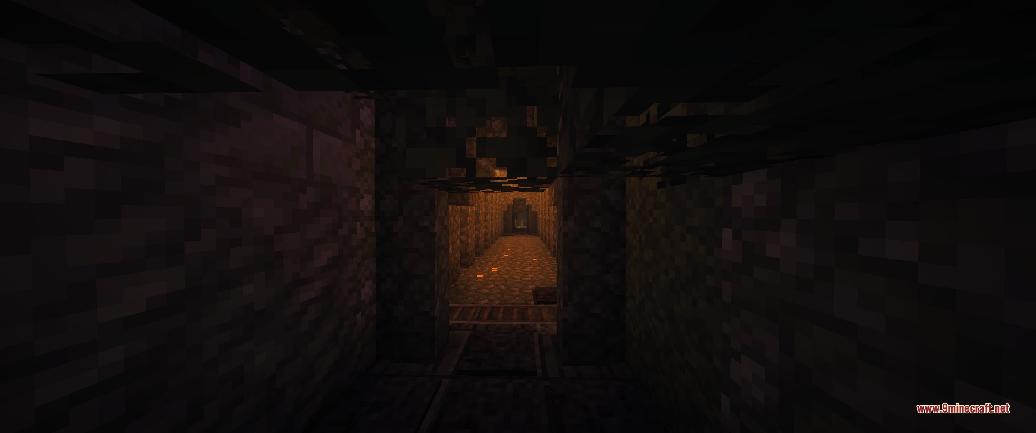 Dark stone hallway leading towards a lit room in an underground dungeon