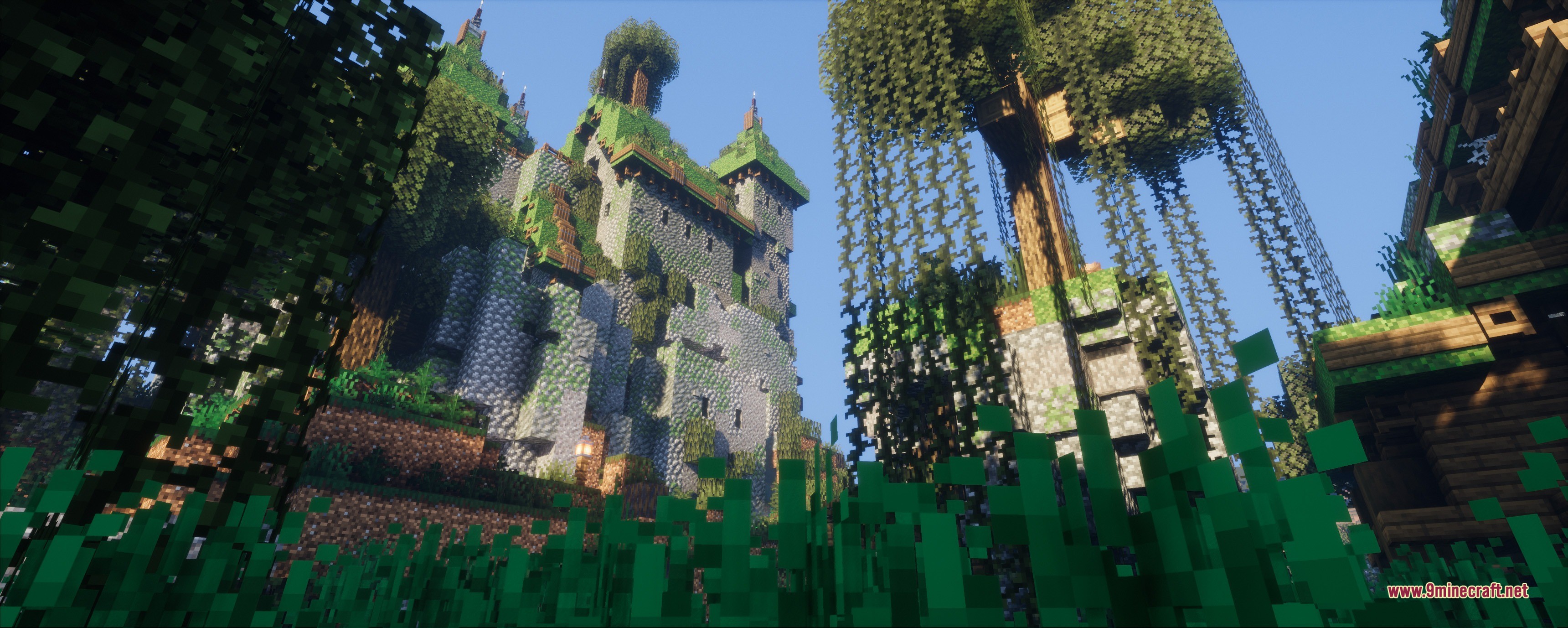 A tall stone castle tower covered in vines and greenery in a forest