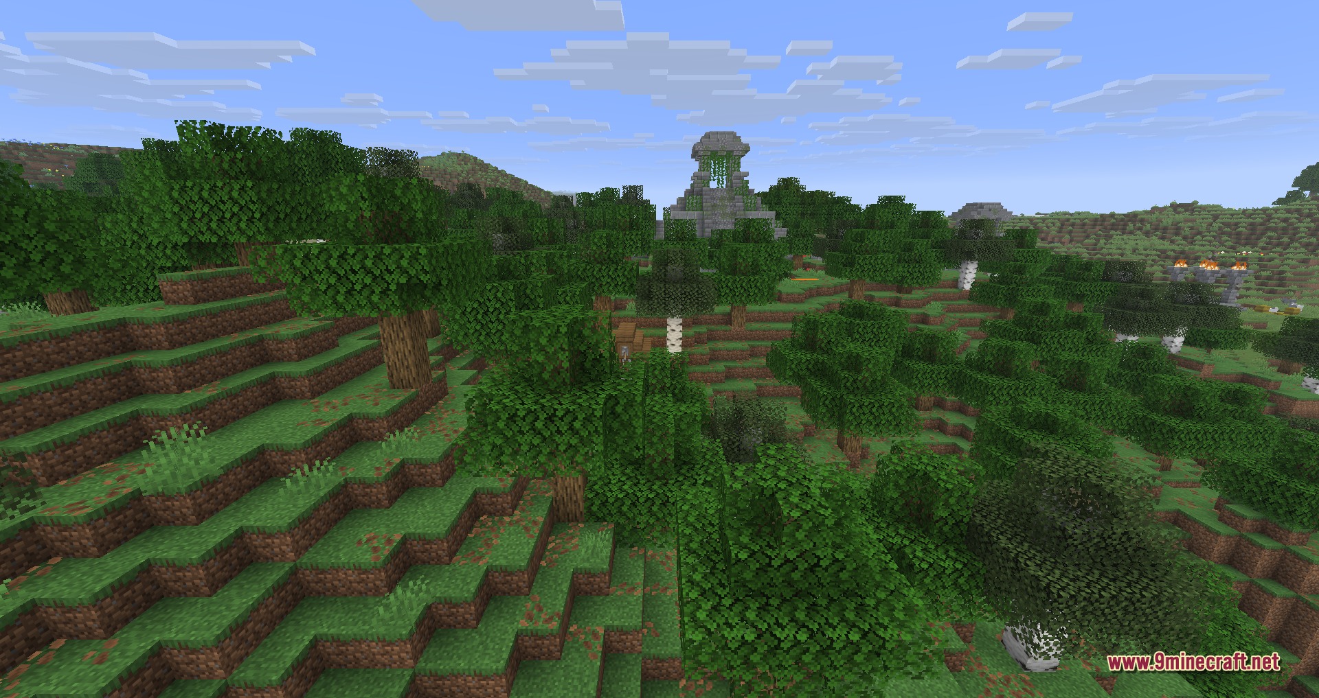 Explorations 9minecraft Mod Screenshot 3 A stone jungle temple structure surrounded by dense trees in a hilly biome
