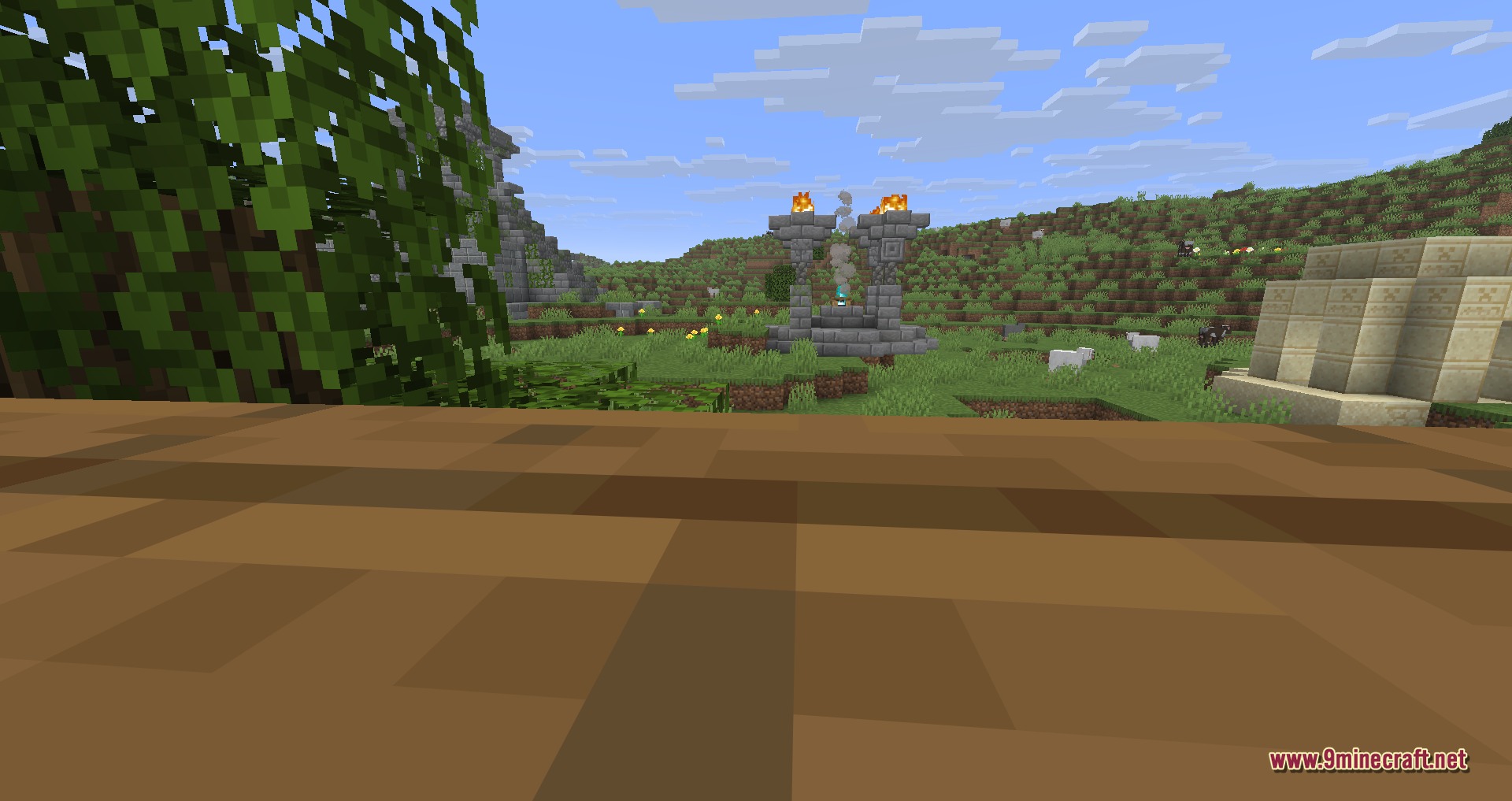 Explorations 9minecraft Mod Screenshot 5 Ancient stone and sandstone structures stand in a vast green Minecraft landscape