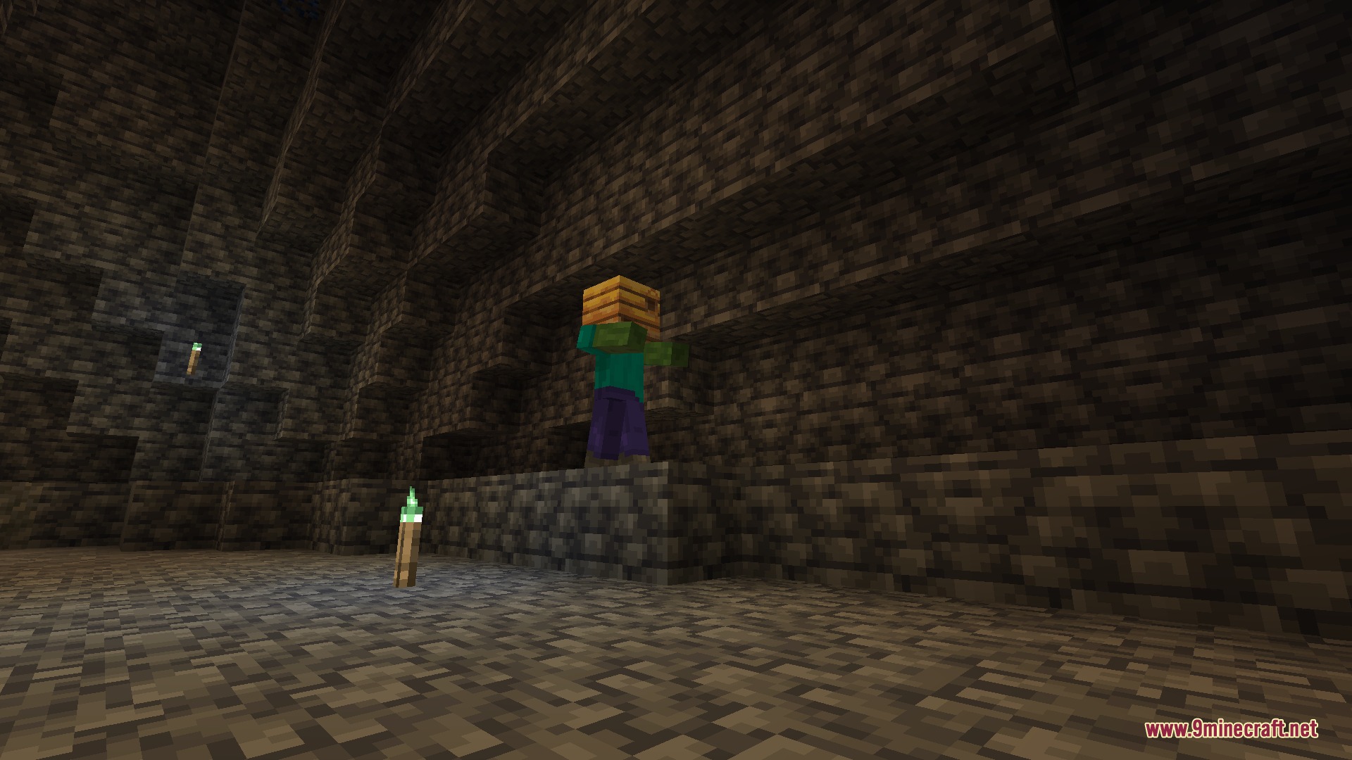 F Zero Drops Mod Screenshot 6 A zombie wearing a carved pumpkin on its head inside a dark cave