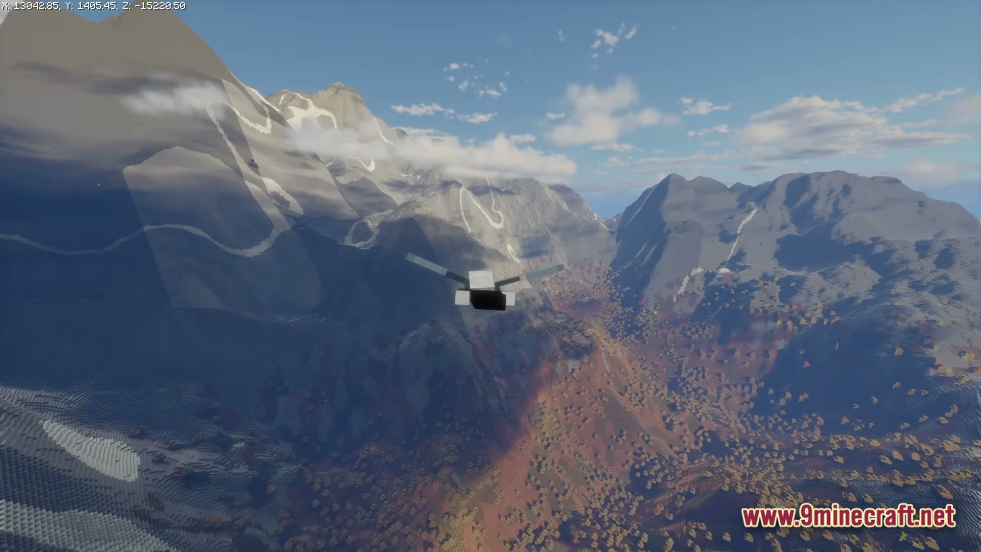 FF's Terra Forge Modpack Screenshot 2 A player glides over a vast mountain range and forested valley using an elytra