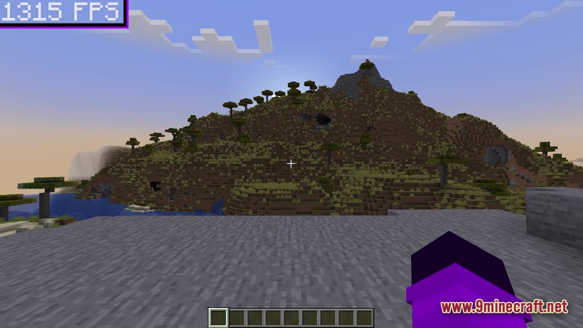 A savanna plateau biome overlooks a body of water under a clear sky with high performance