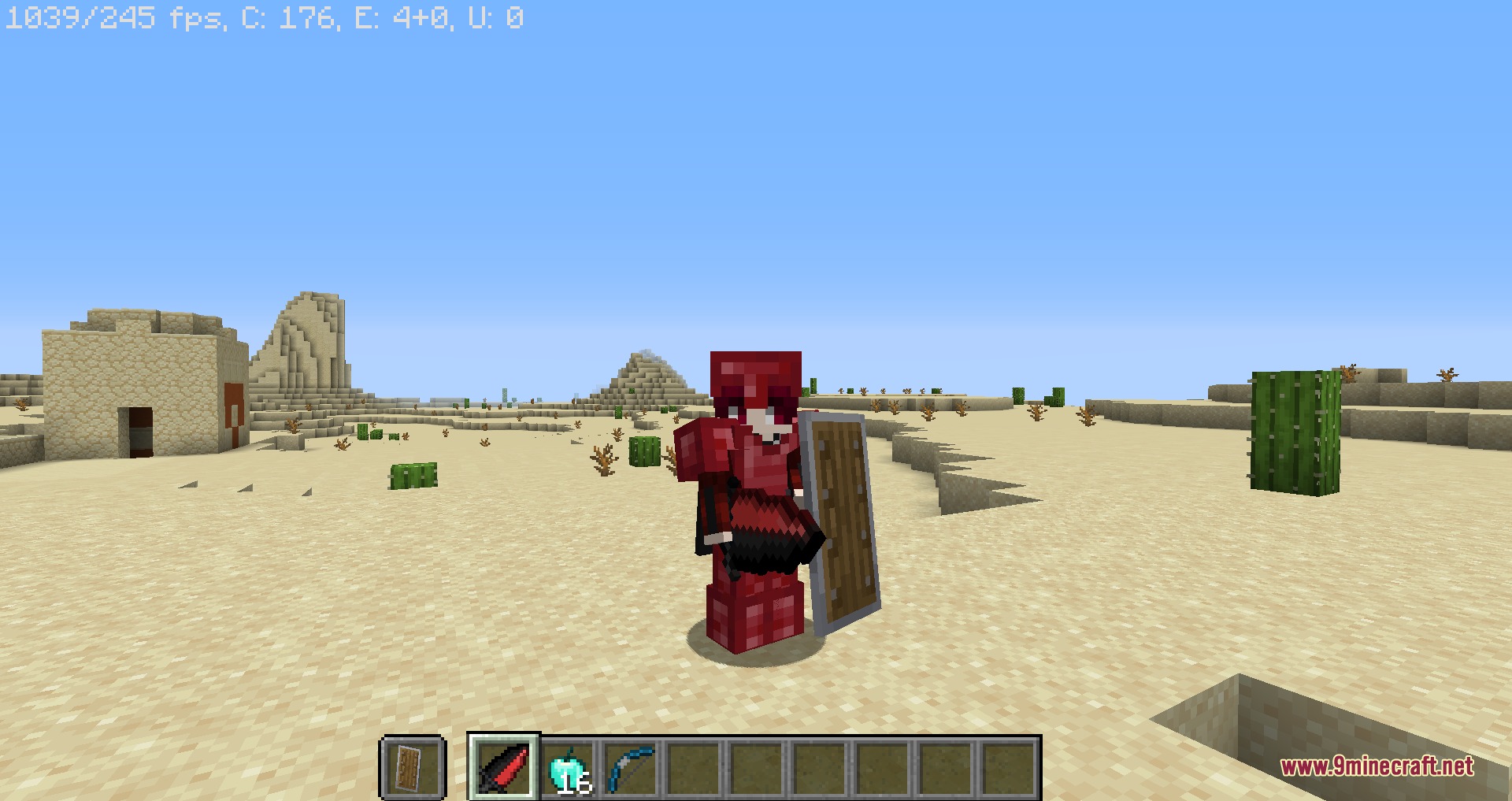 Minecraft player wearing red Nightmare armor and holding a sword in a desert