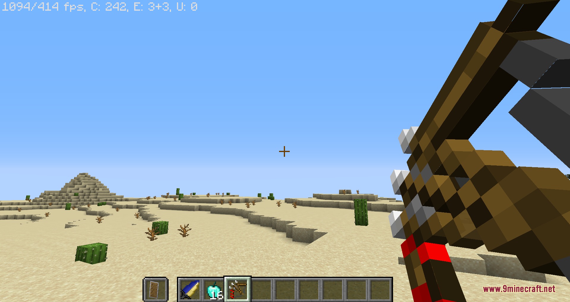 Player aiming a heavy titan crossbow in a sunny desert biome
