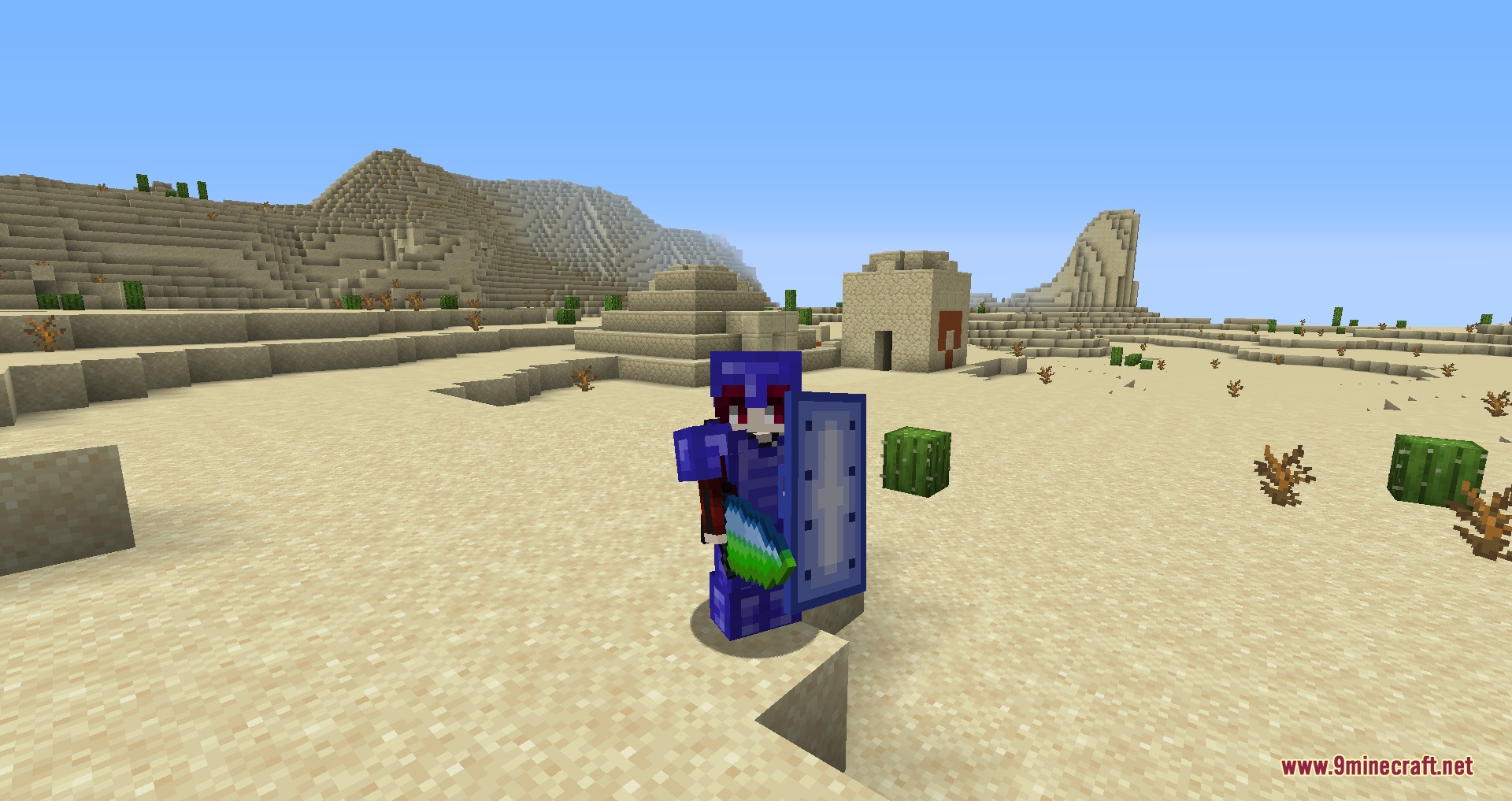 Player wearing blue Titan armor stands in a desert near a temple
