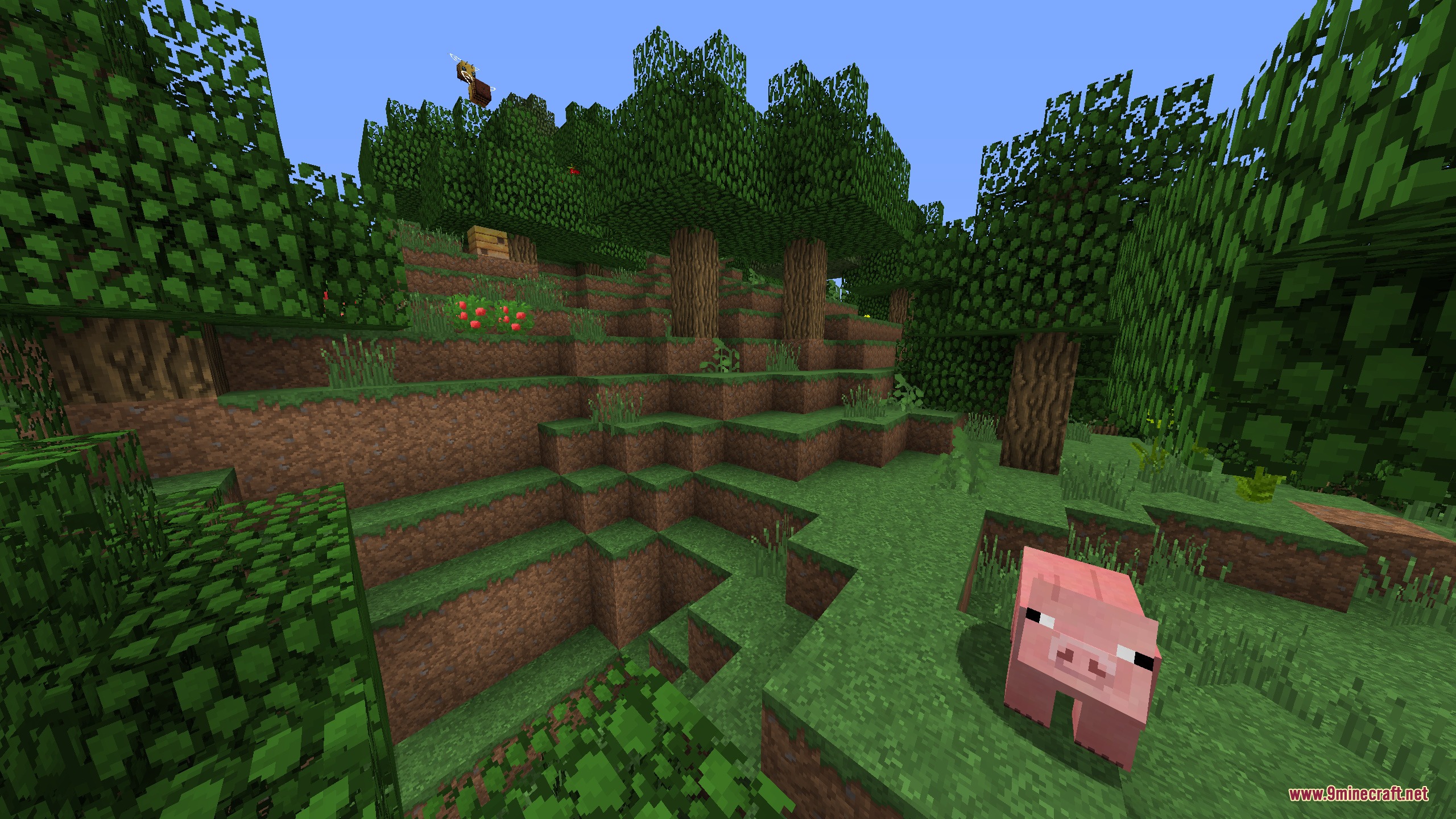 Faithful 32x Modded Resource Pack Screenshot 2 A pink pig stands in a forest with berry bushes and a beehive