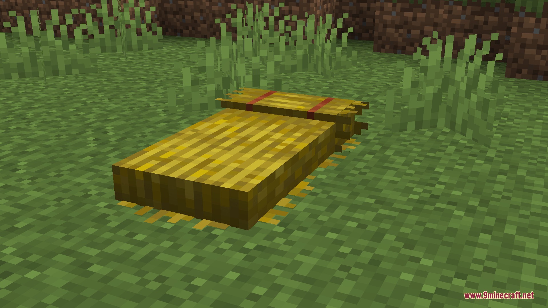 Falldrop Backport Mod Screenshot 6 A rustic straw bed placed on the grass in a Minecraft world