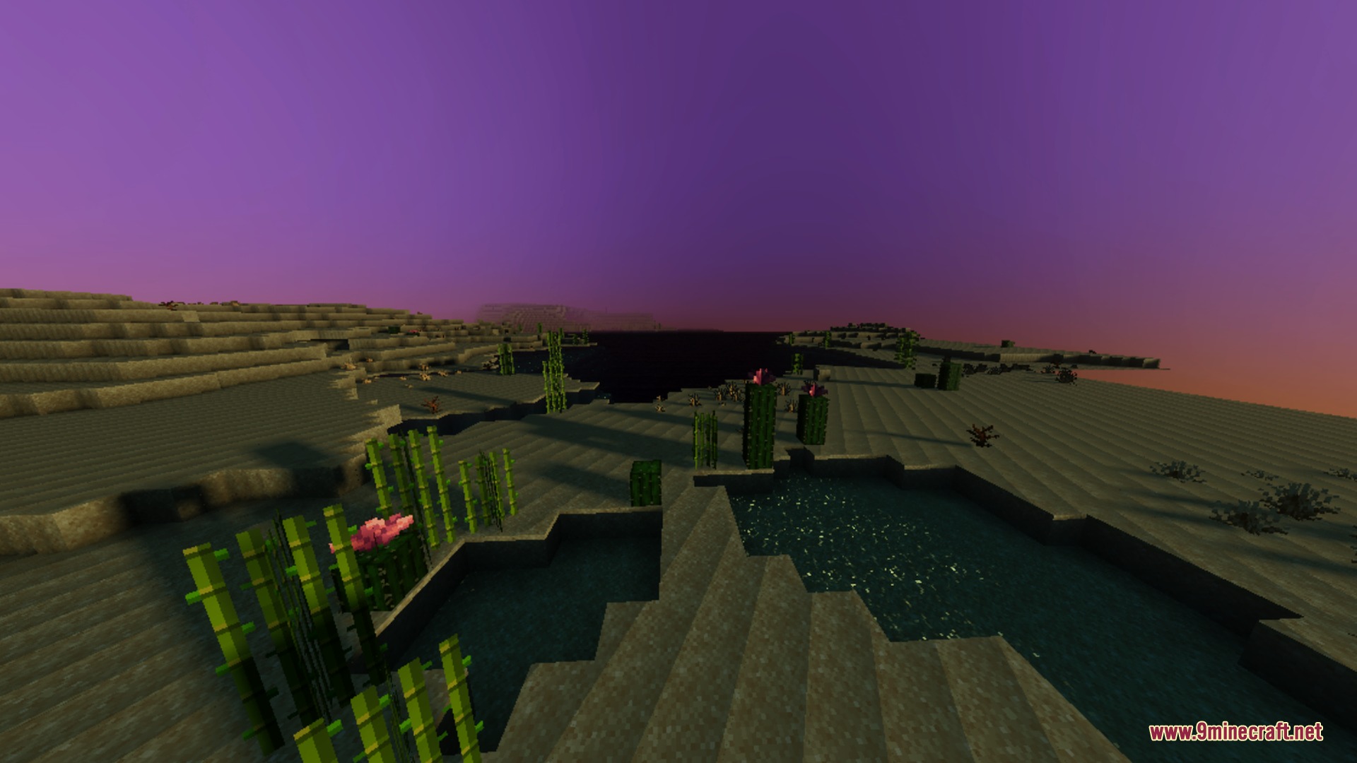 A desert landscape with bamboo and water under a vibrant purple sky