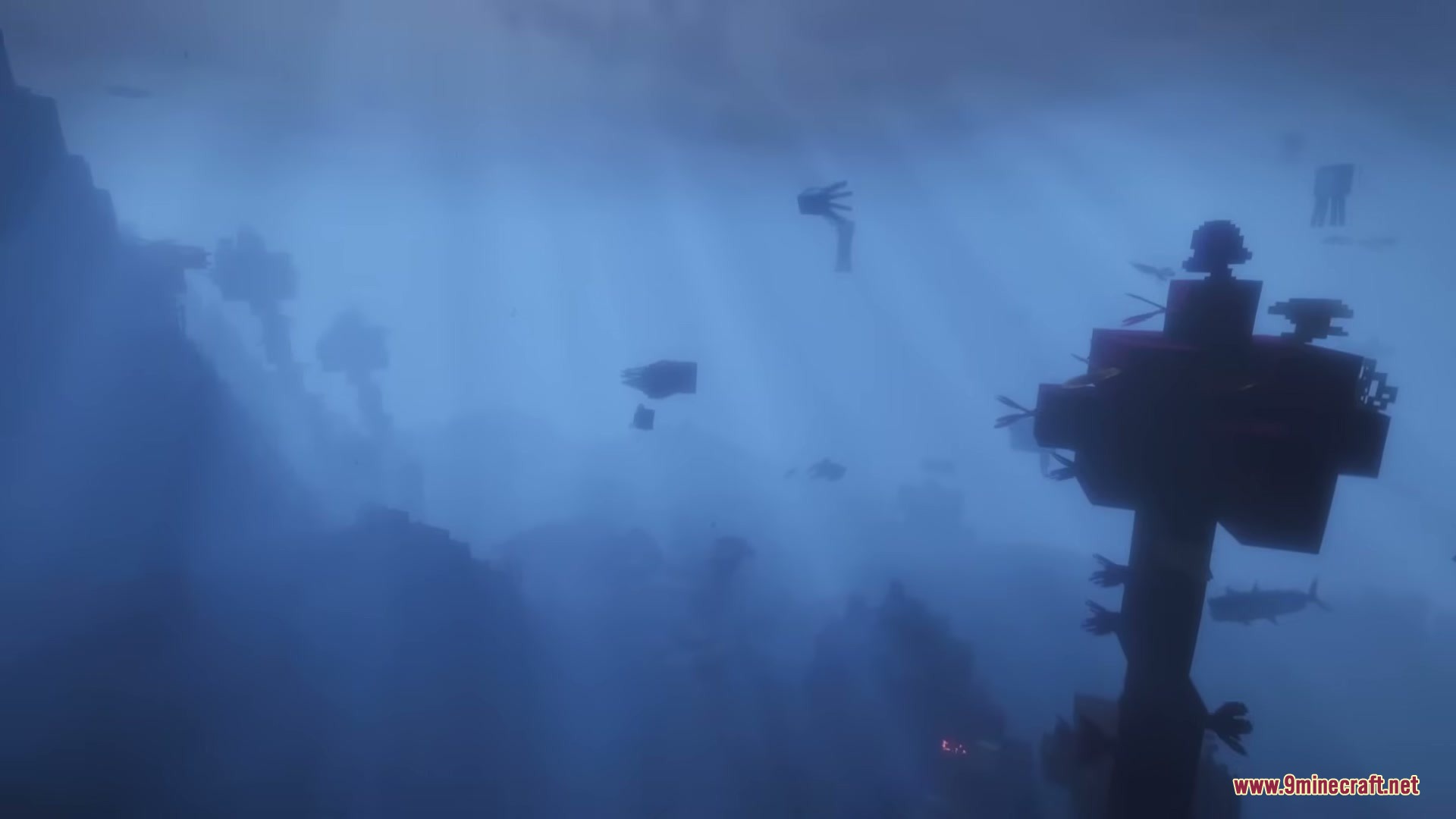 Strange aquatic creatures swimming through the hazy blue waters of the deep ocean