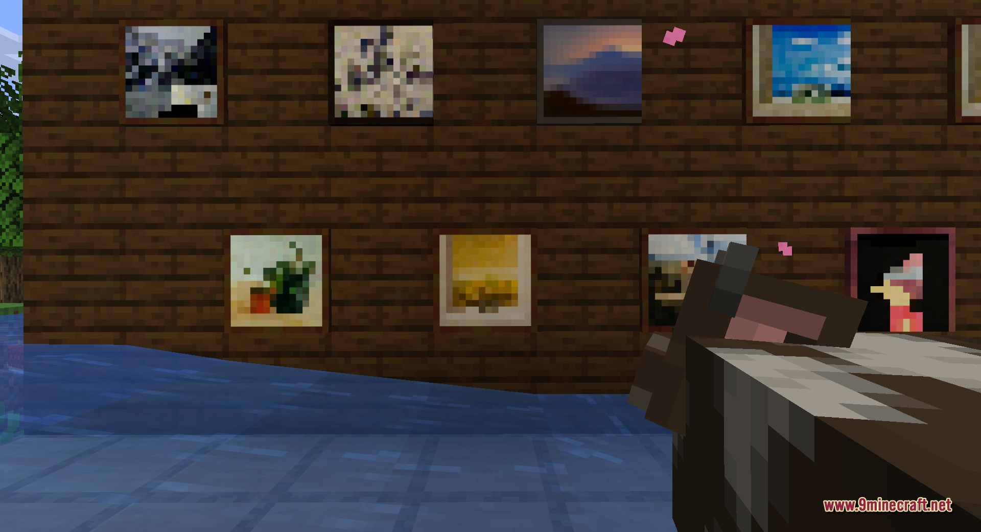 Fast Paintings 9minecraft Mod Screenshot 4 Close up of paintings on a wooden wall with a cow looking on