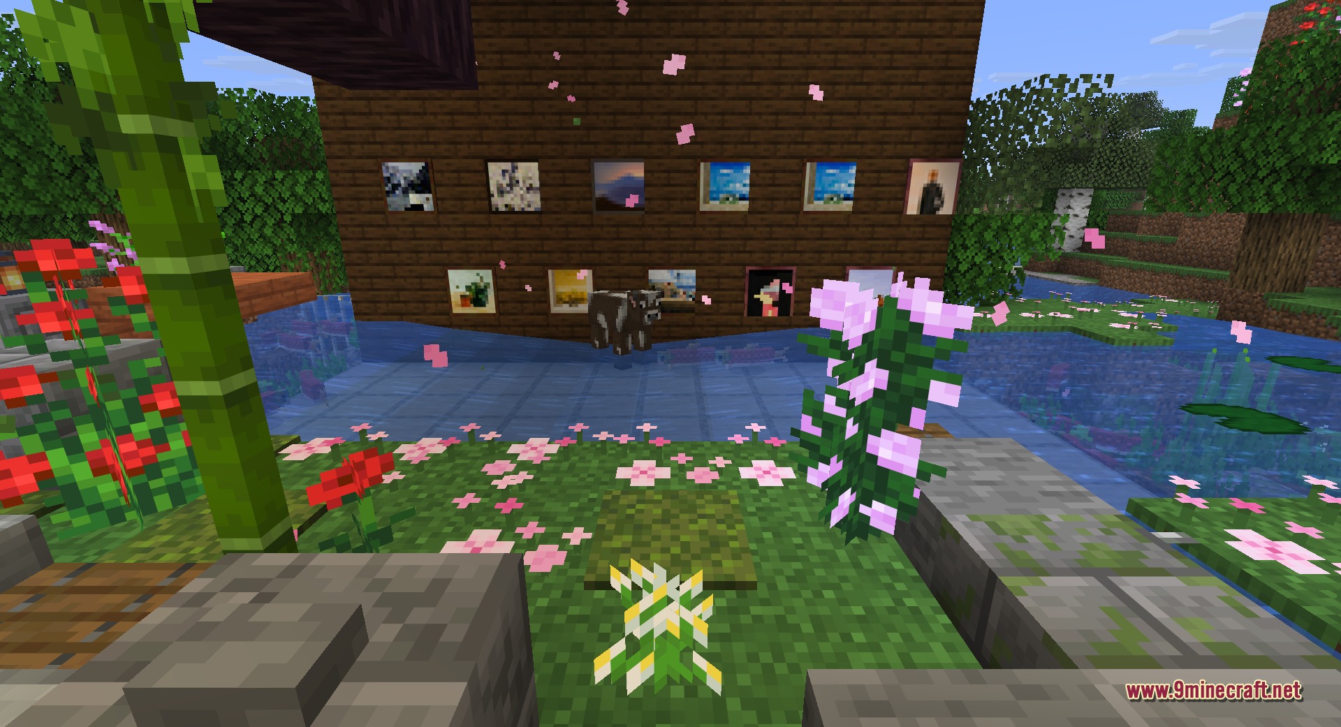 Fast Paintings 9minecraft Mod Screenshot 6 A wooden wall featuring several paintings surrounded by flowers and cherry blossom petals