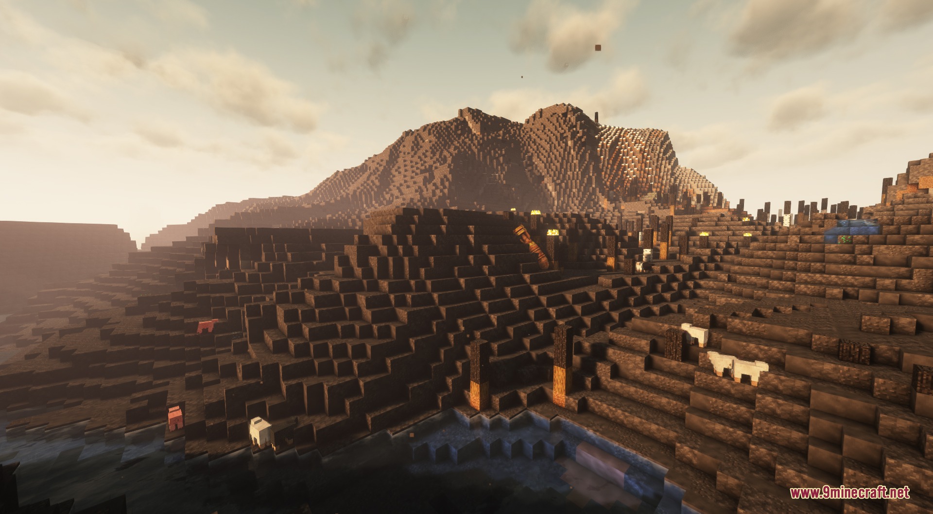 Fissionized Legacy Redux Mod Screenshot 2 Sheep grazing on a hilly landscape with industrial ruins and mountains
