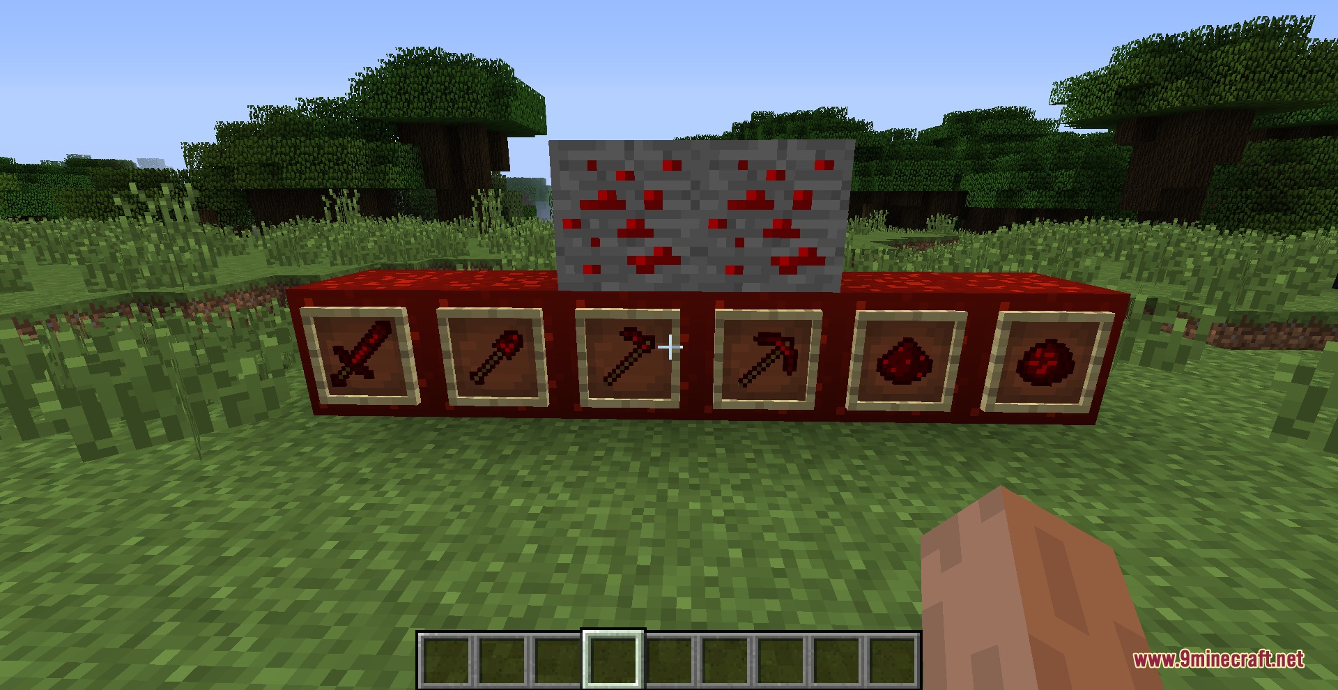 Redstone tools and materials showcased in item frames on redstone blocks