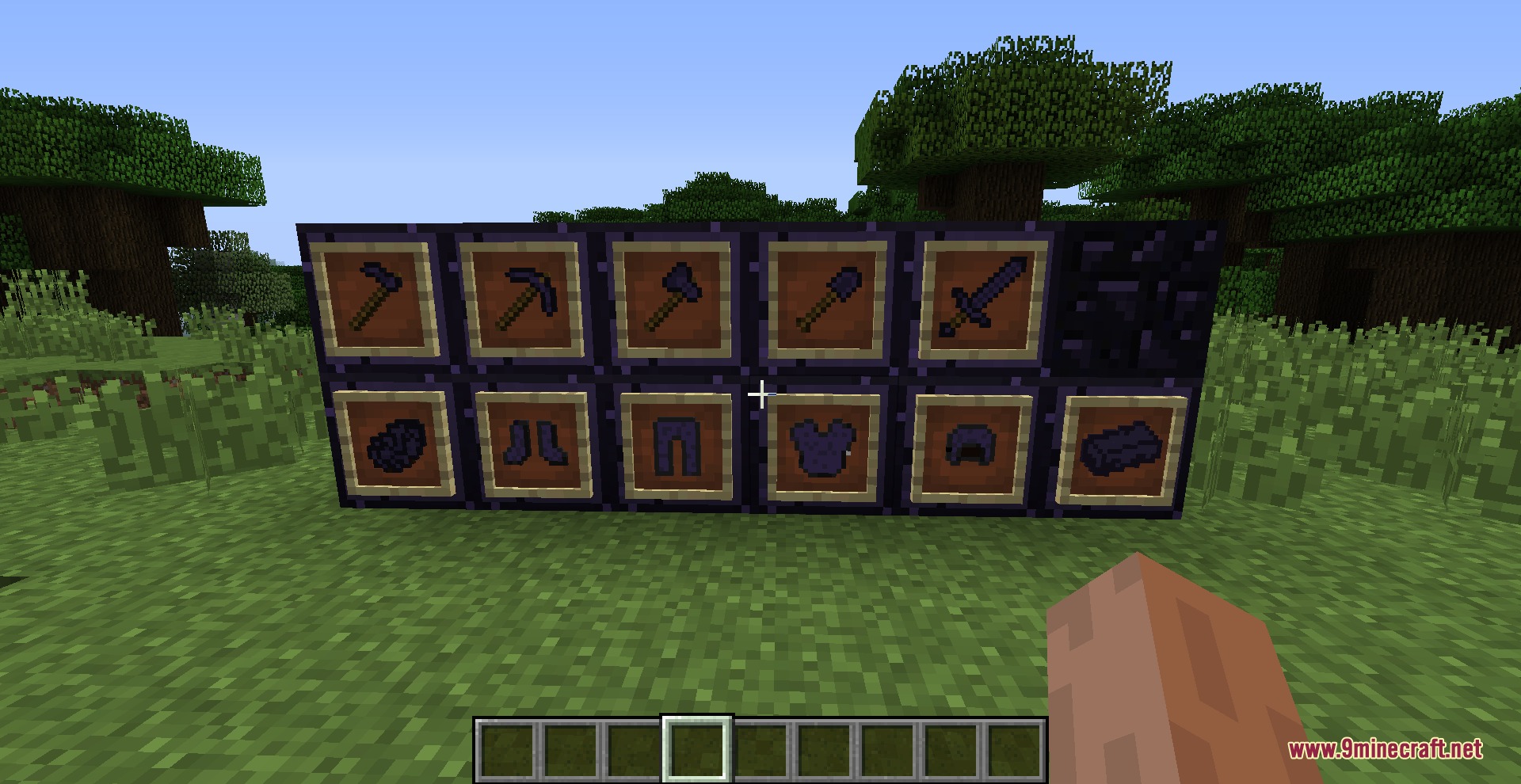 Obsidian tools and armor sets displayed on a wall of obsidian blocks