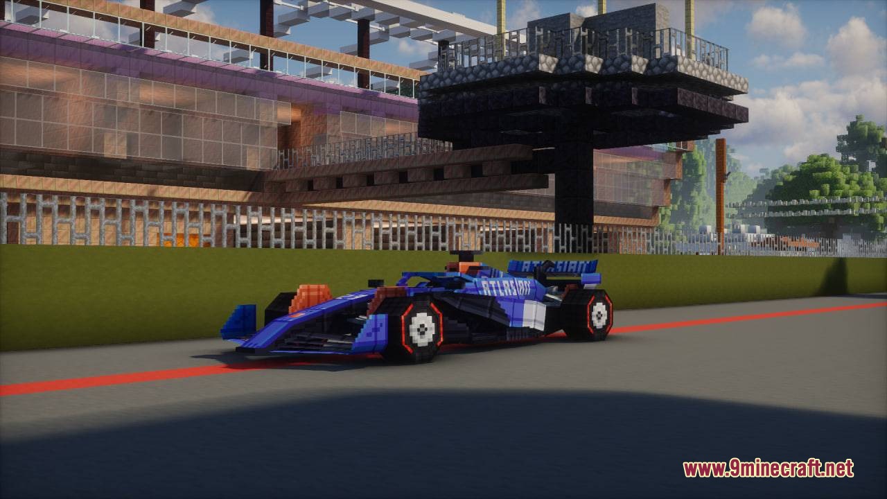 Formula MC Mod Screenshot 1 Blue and orange formula racing car driving on a professional Minecraft circuit track