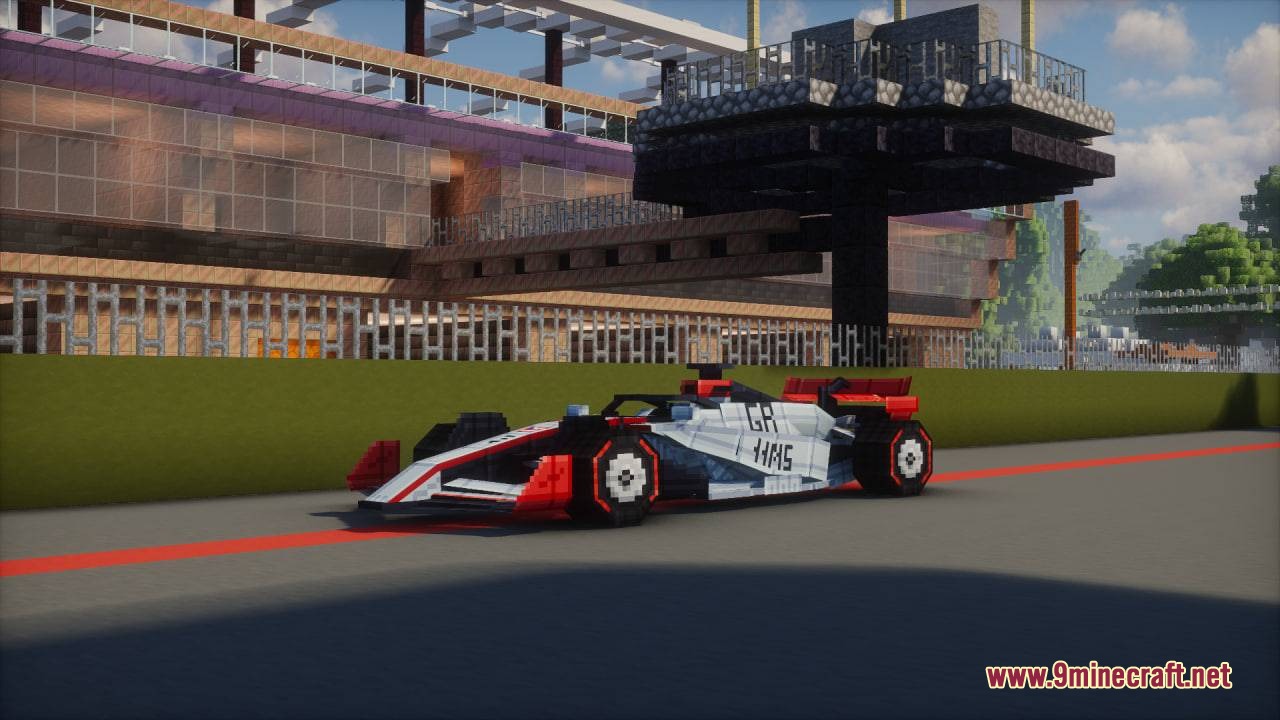 Formula MC Mod Screenshot 3 A white and red Haas Formula One car on a Minecraft track