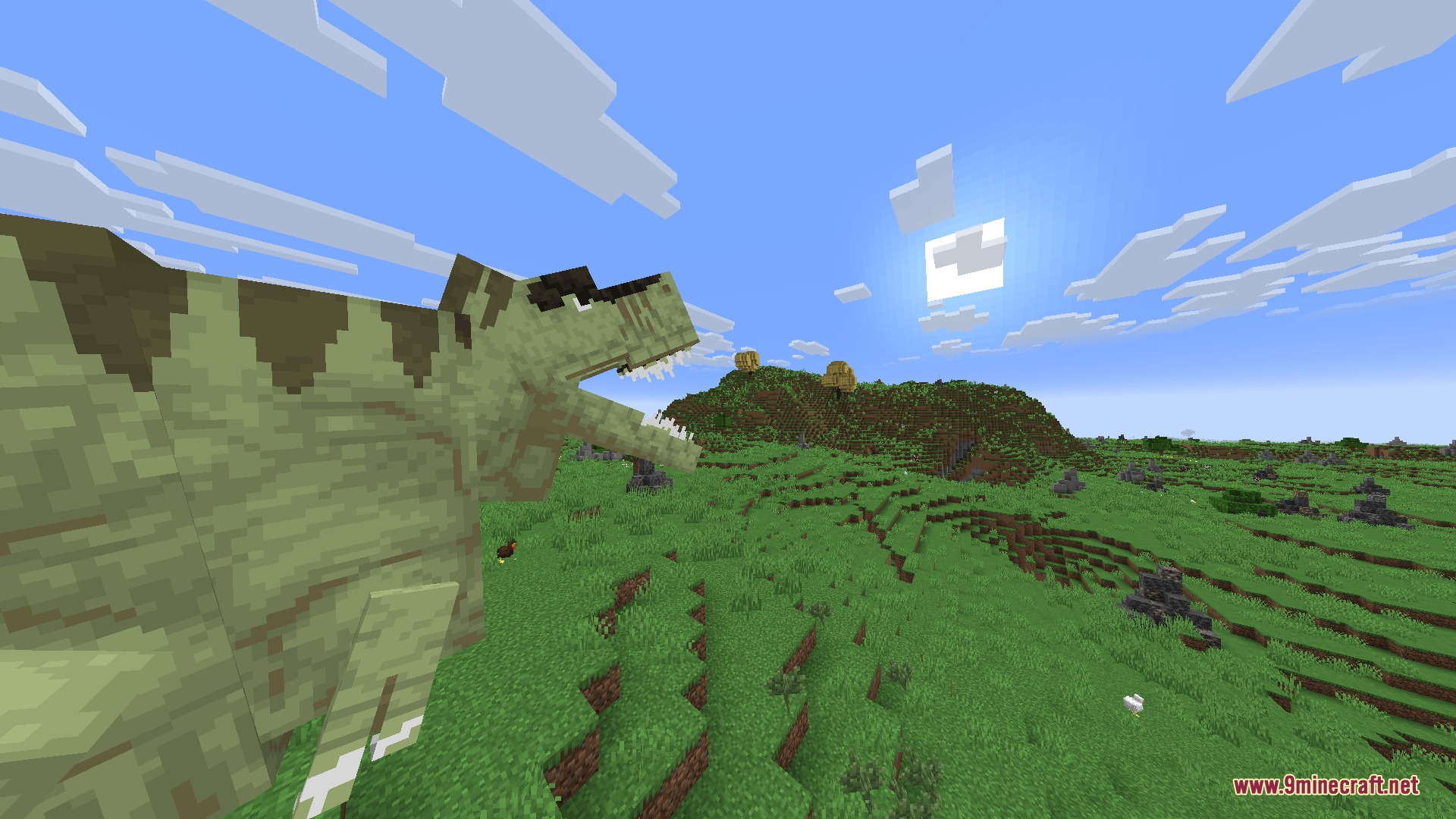 Fossils&Archeology Origins Mod Screenshot 1 A large green Tyrannosaurus Rex stands in a grassy field with mouth open