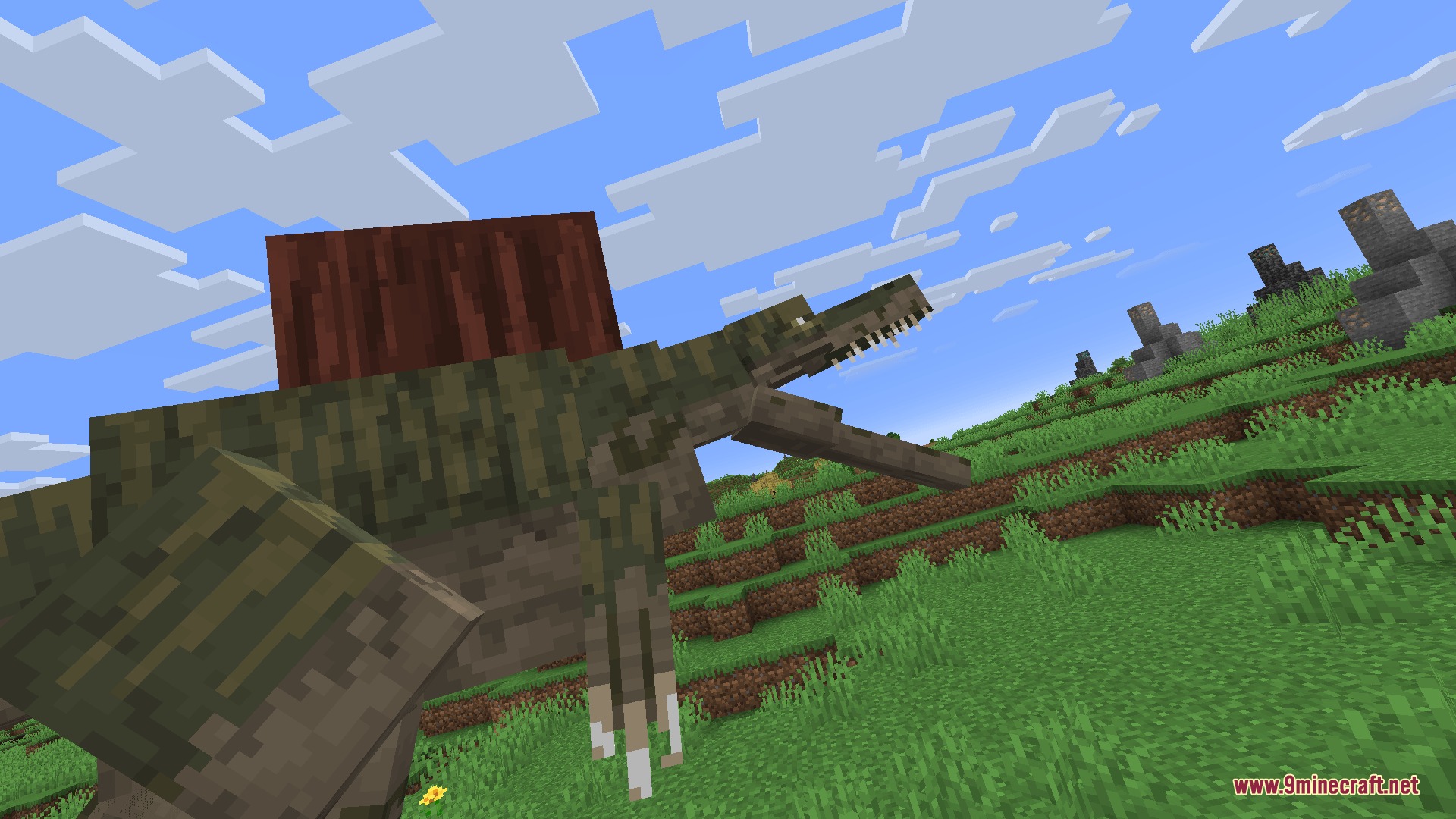 Fossils&Archeology Origins Mod Screenshot 3 A large Spinosaurus with a red sail roars in a grassy Minecraft field