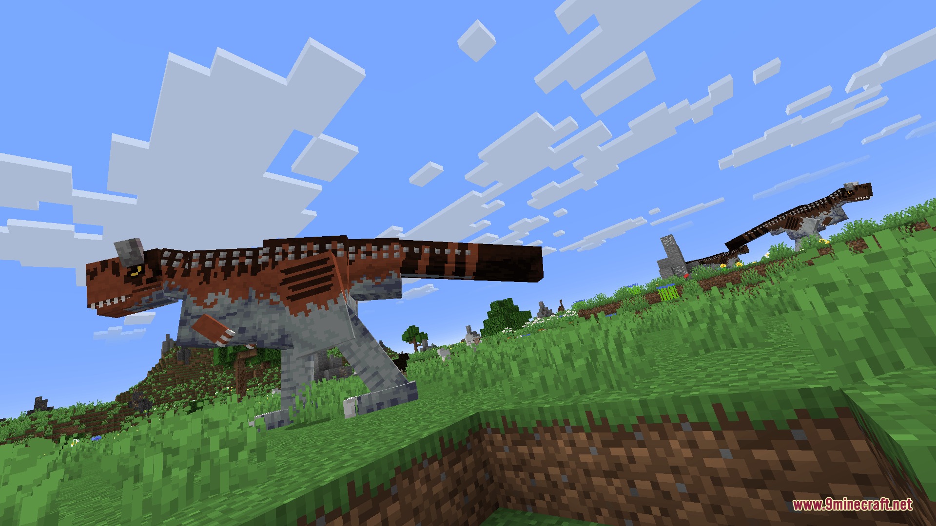 Fossils&Archeology Origins Mod Screenshot 6 A large brown dinosaur walks across a grassy hill in a Minecraft world