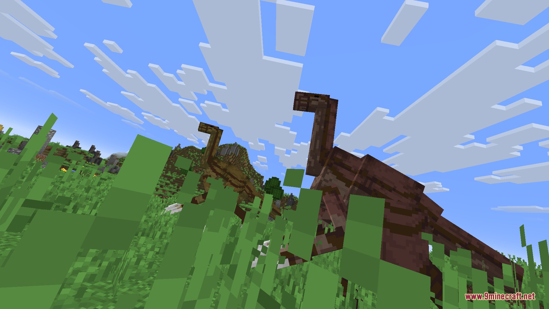 Fossils&Archeology Origins Mod Screenshot 8 Two large brown dinosaurs standing together in tall green grass under clouds