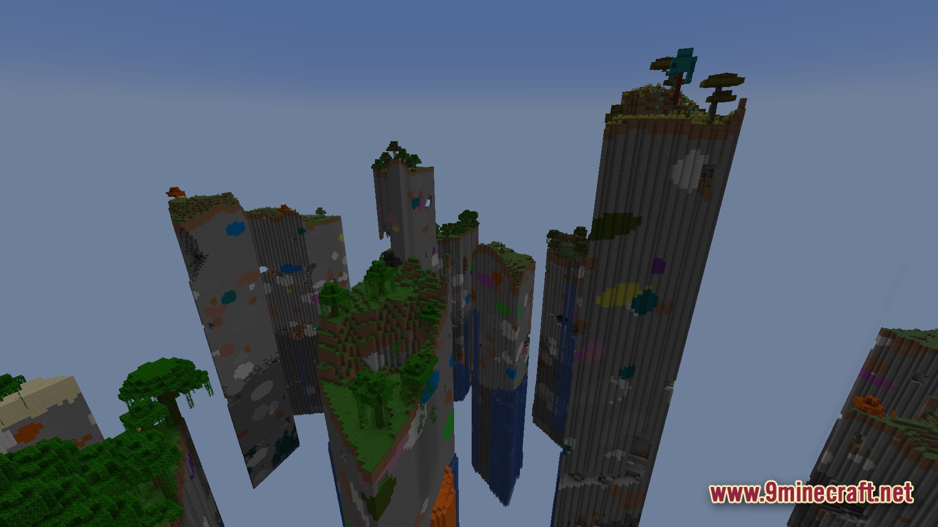 Tall stone pillars with various biomes and colorful ore deposits floating in a void world