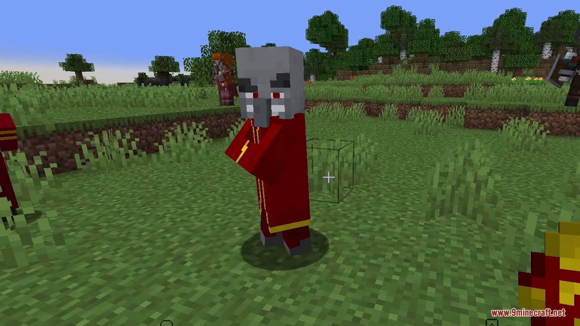 Fresh Illager Mod Compats Resource Pack Screenshot 8 A single Illager wearing a red robe standing in the grass
