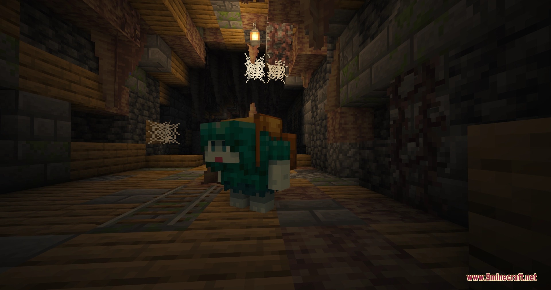 Friends&Foes Forge Neo Forge Mod Screenshot 6 A small Rascal creature standing near minecart tracks in a dark cave