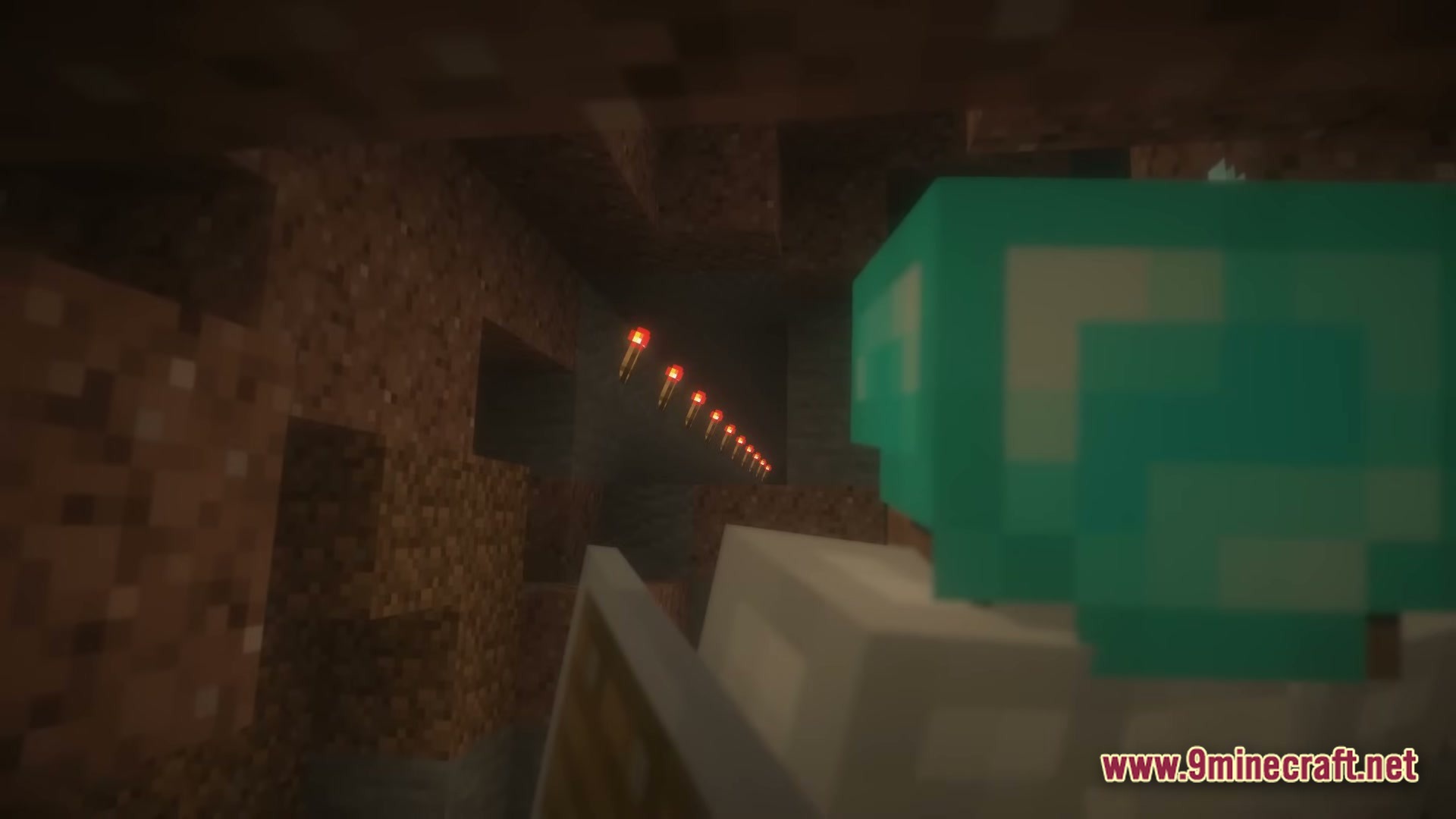 From The Fog Modpack Screenshot 6 A player in diamond armor looks at a trail of redstone torches inside a dark cave