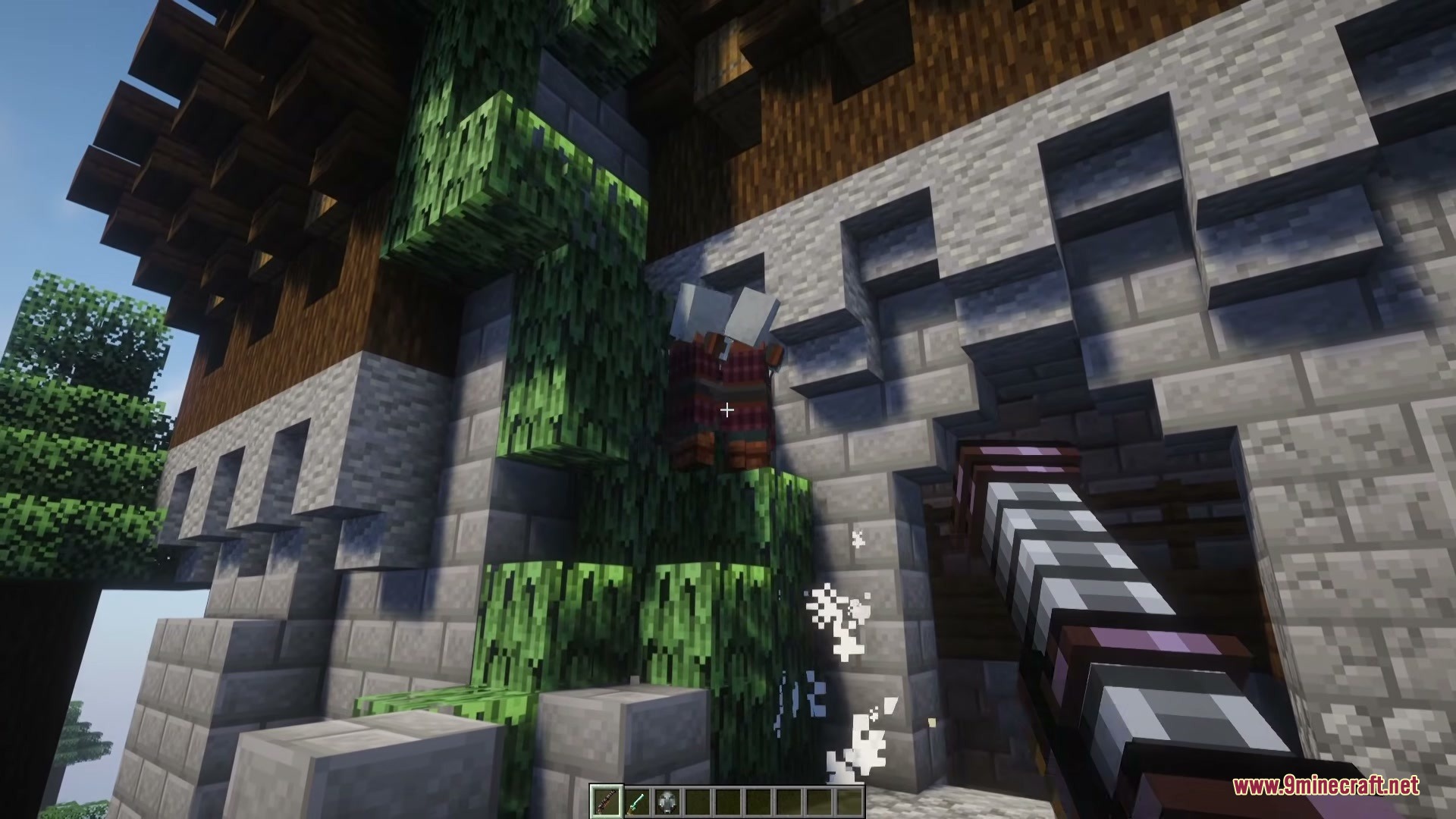 Frontier Armaments Mod Screenshot 5 A player aims a Firecannon at a mob climbing a stone wall