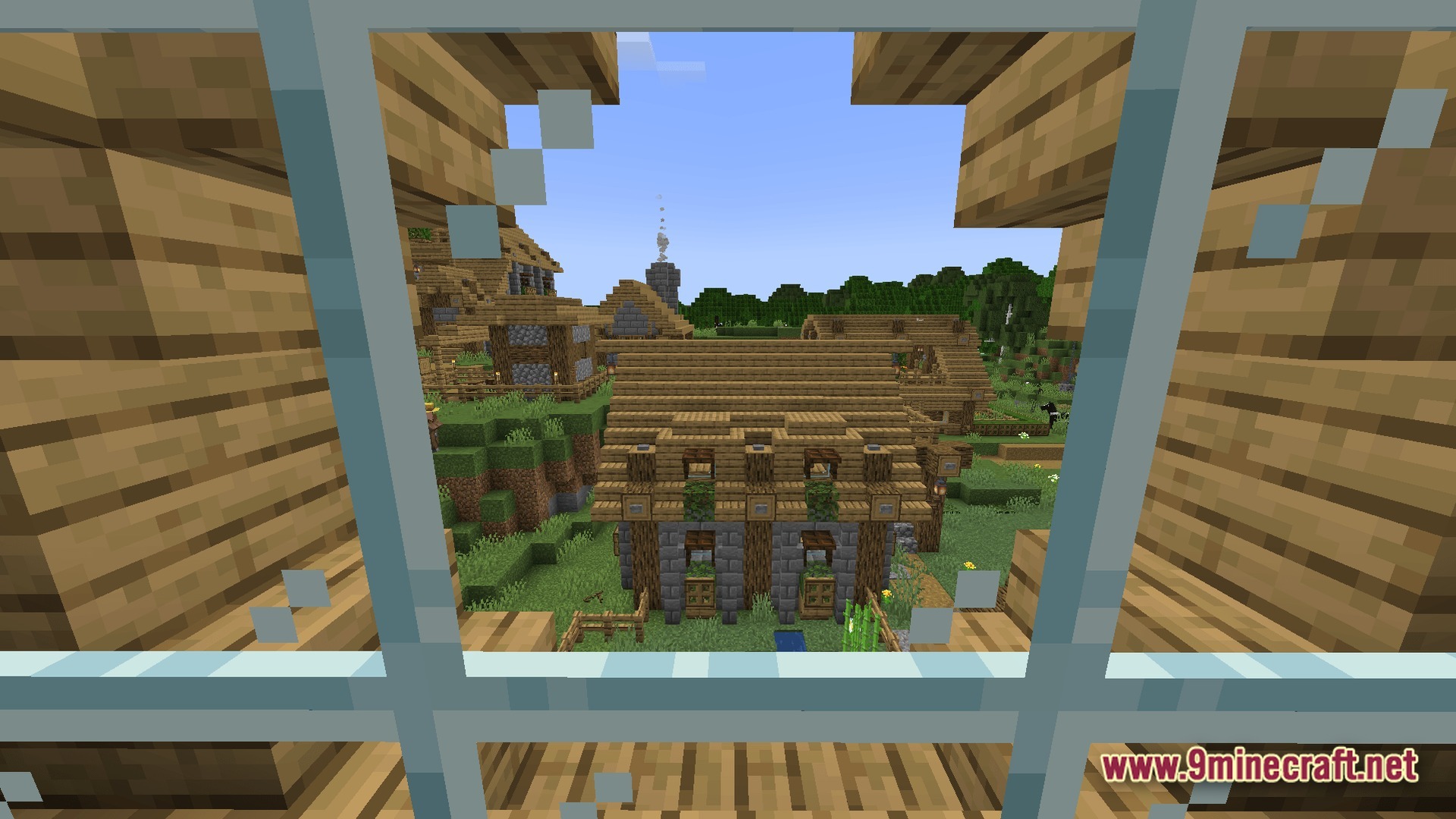 Frontier Combat Engine Modpack Screenshot 5 A view through a glass window overlooking a village with wooden and stone buildings