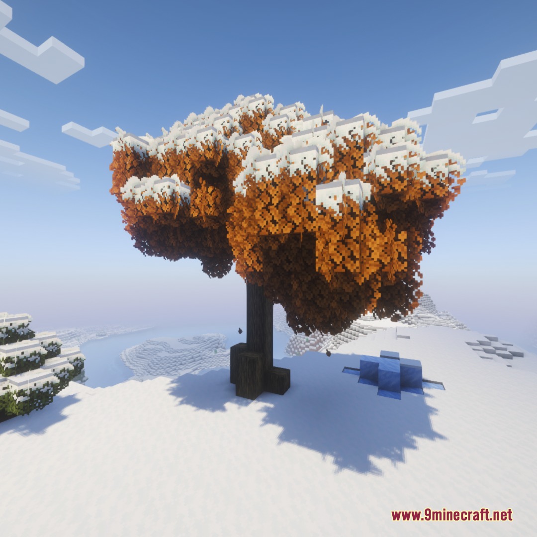 Frost Glazed Canopies Mod Screenshot 2 Orange tree leaves covered in thick snow within a winter Minecraft biome