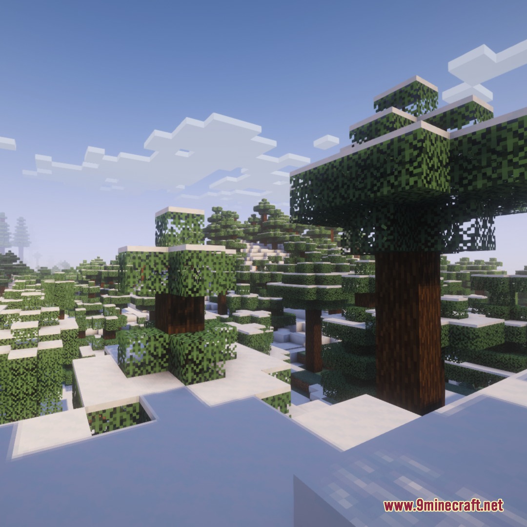 Frost Glazed Canopies Mod Screenshot 7 Snowy tree leaves in a winter forest biome under a clear sky